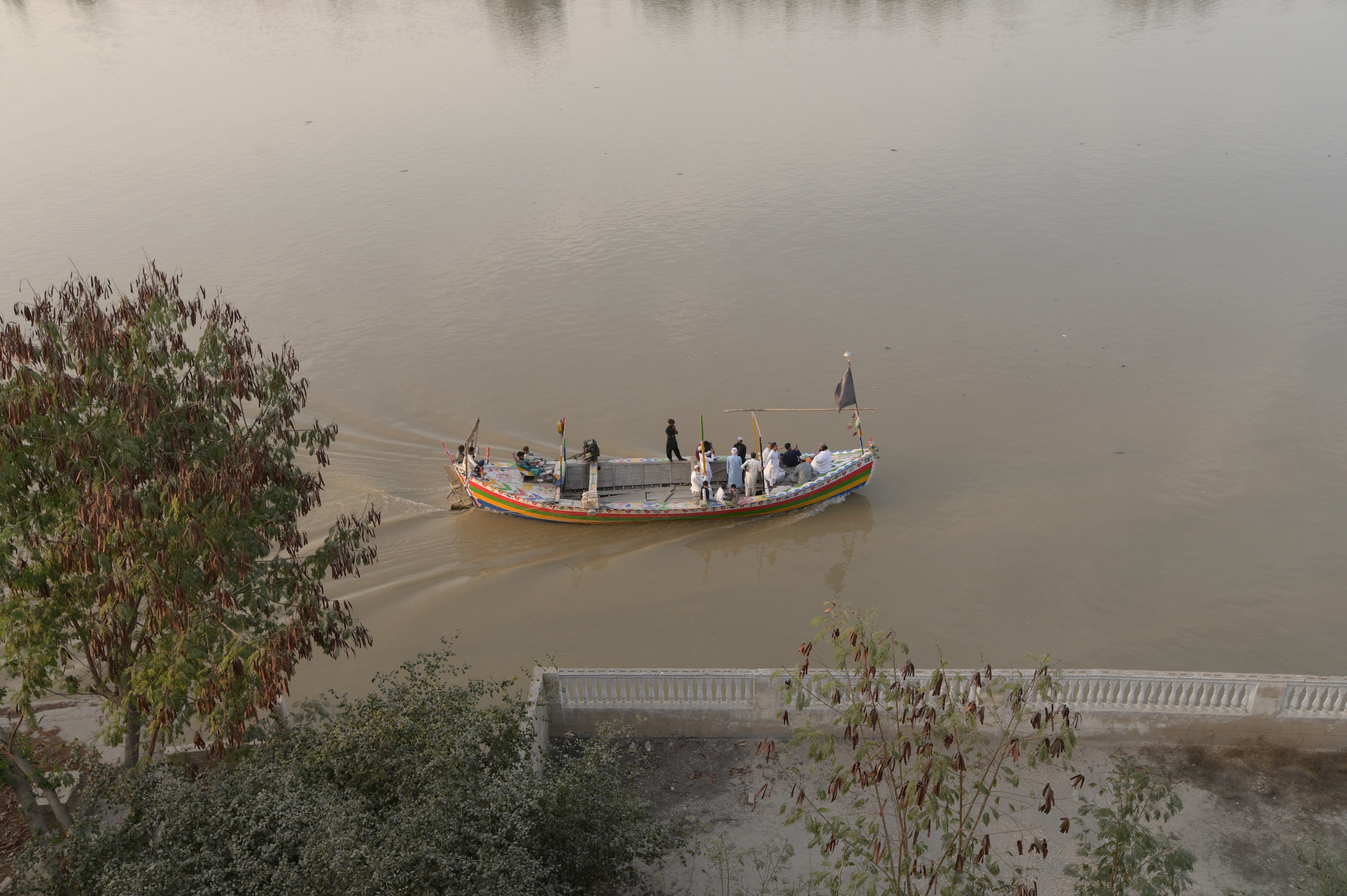 A boat passing by the river