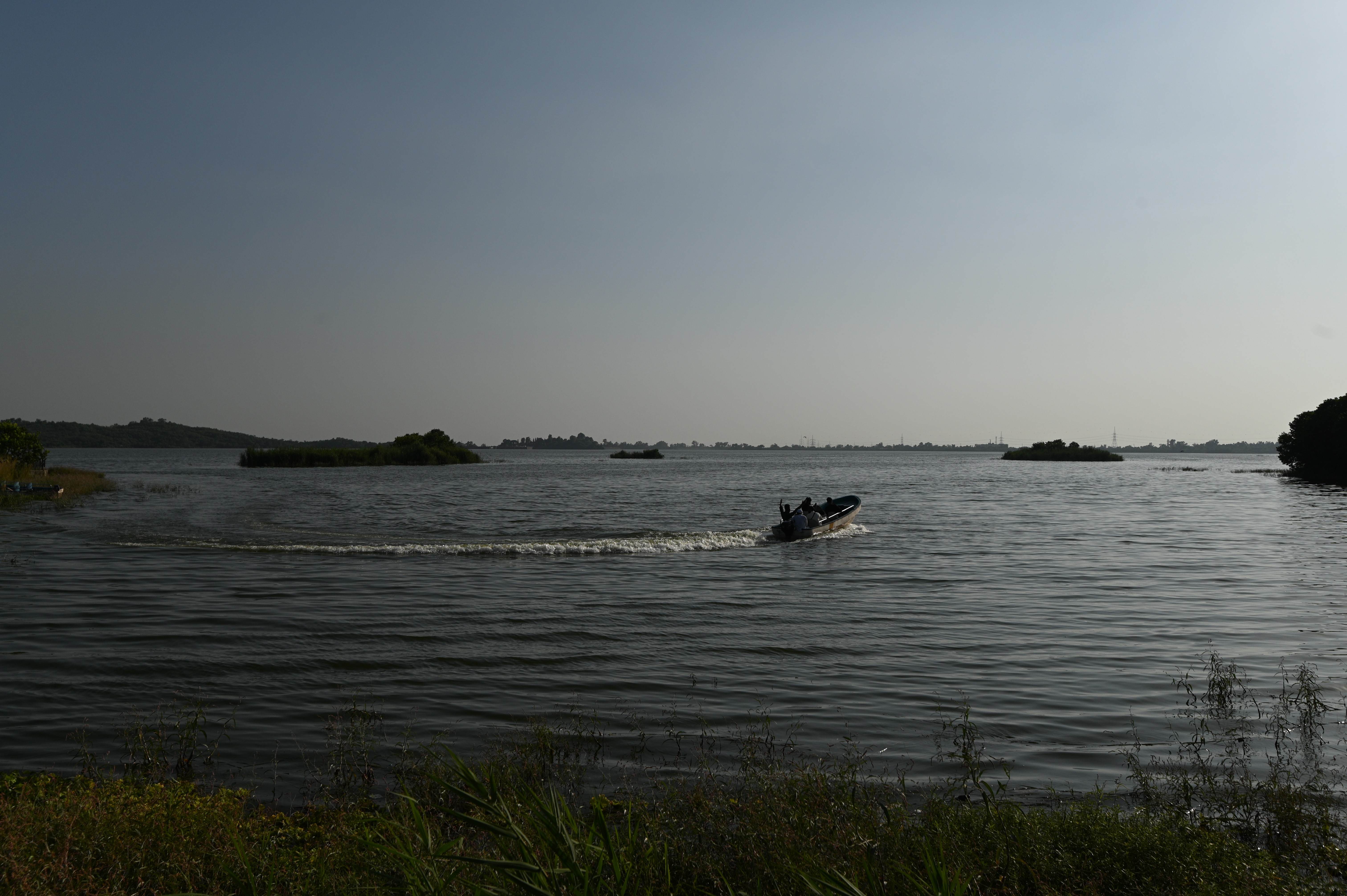 tourists enjoying the boat ride in lake