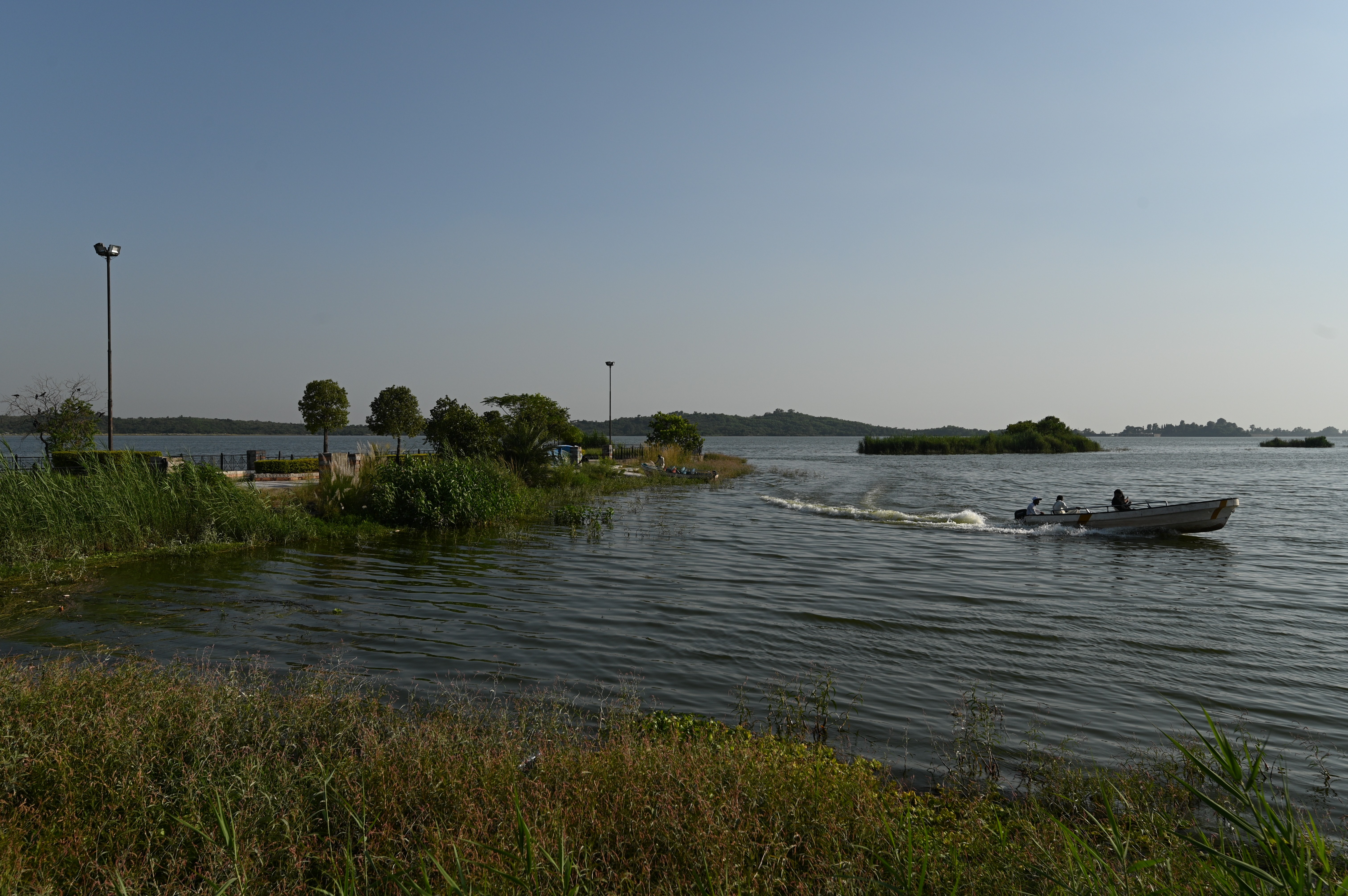 tourists enjoying the boat ride in lake