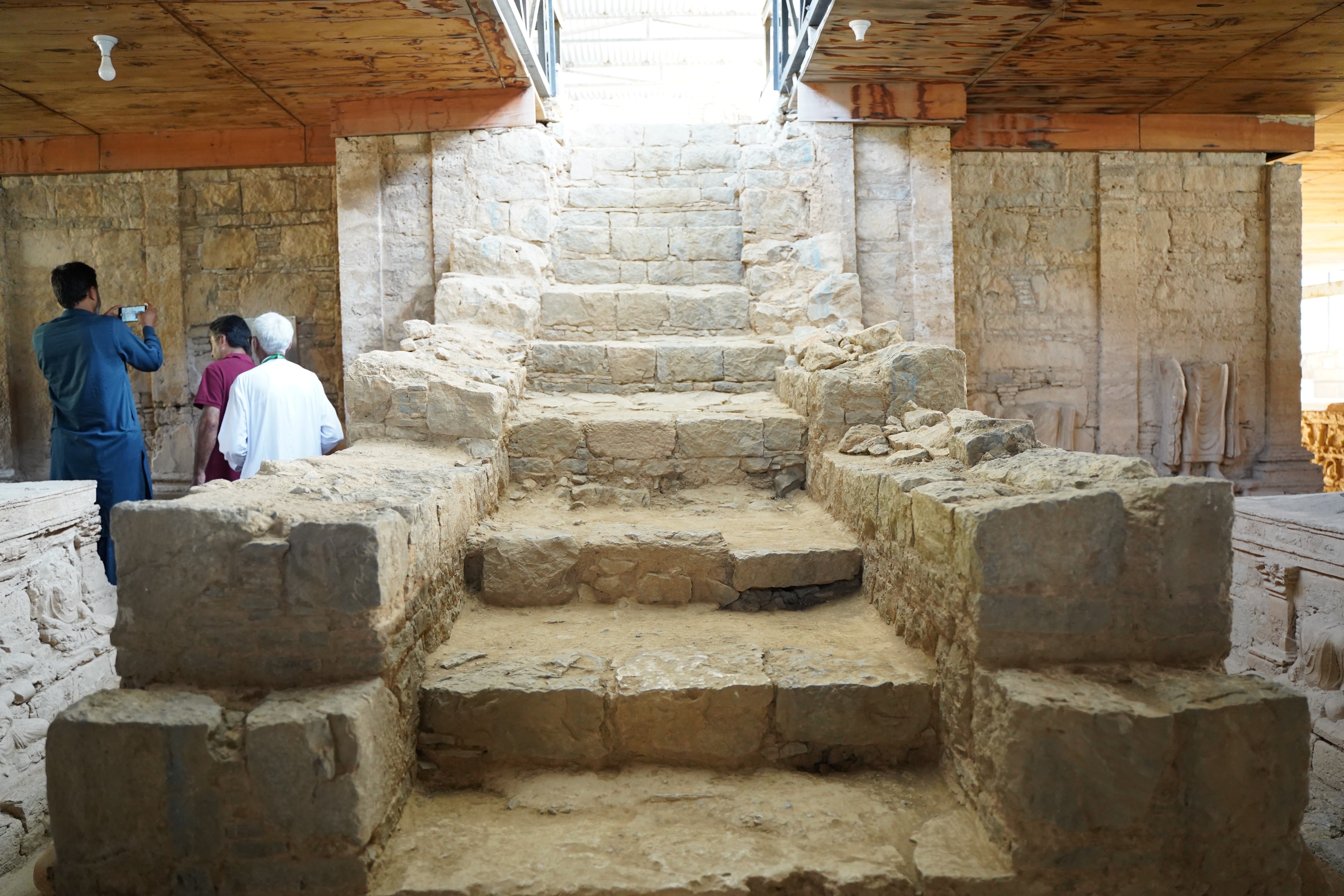 A staircase leads to the basement where replica of the orignal figures has been placed