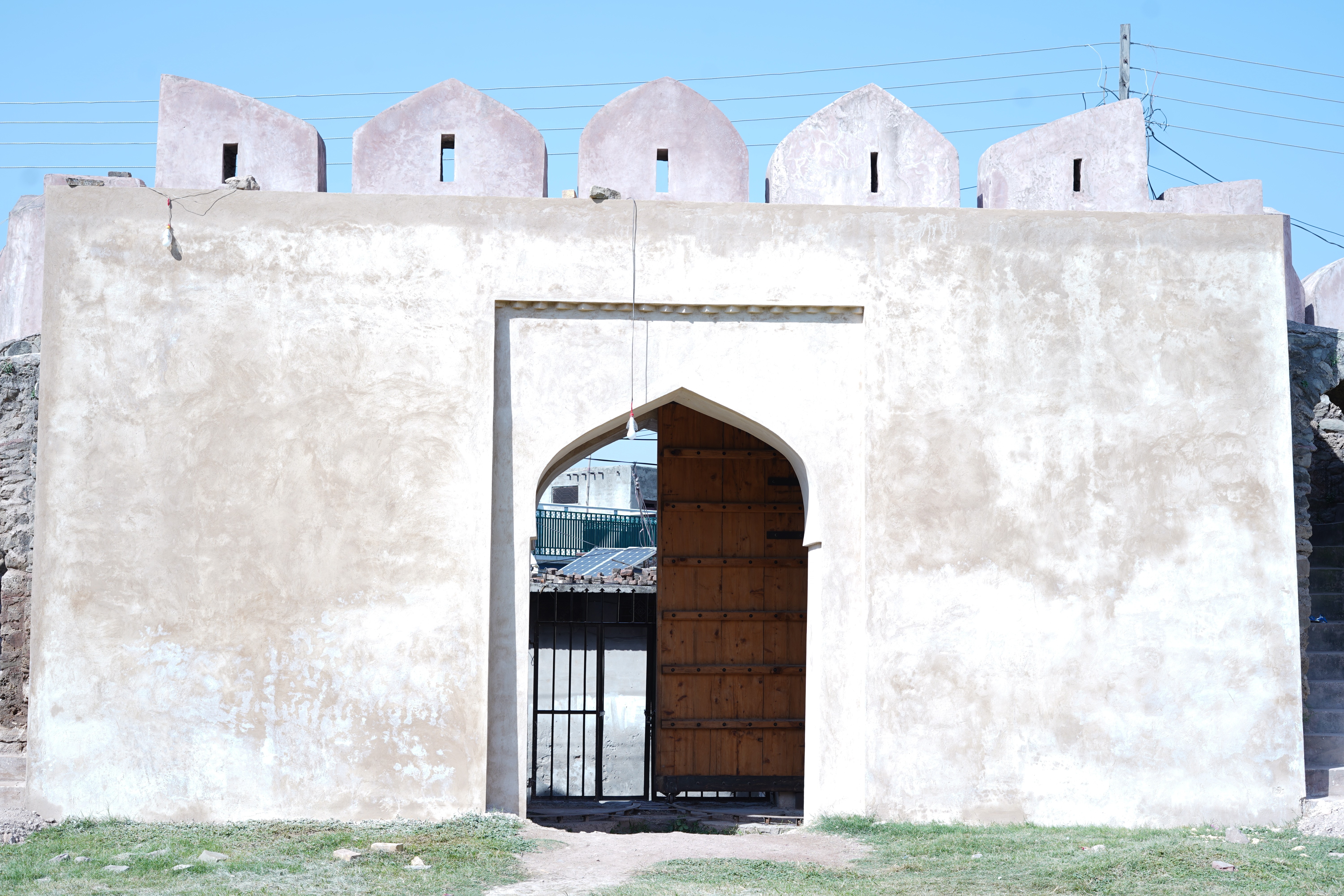 The demolished wall of Rawat Fort is reconstructed to preserve the ancient remains