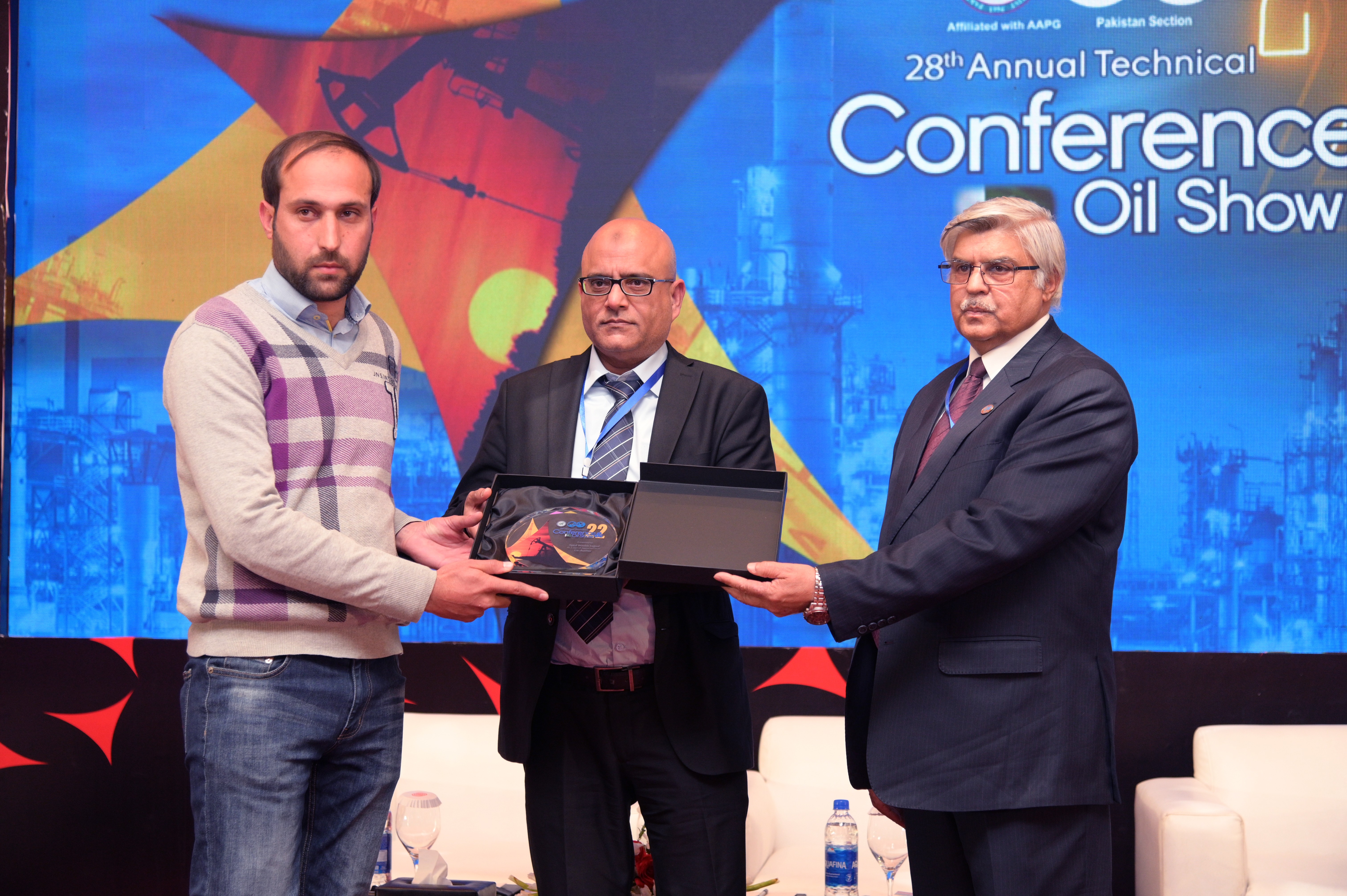 Shields distribution ceremony to the participants at the event of conference and oil show