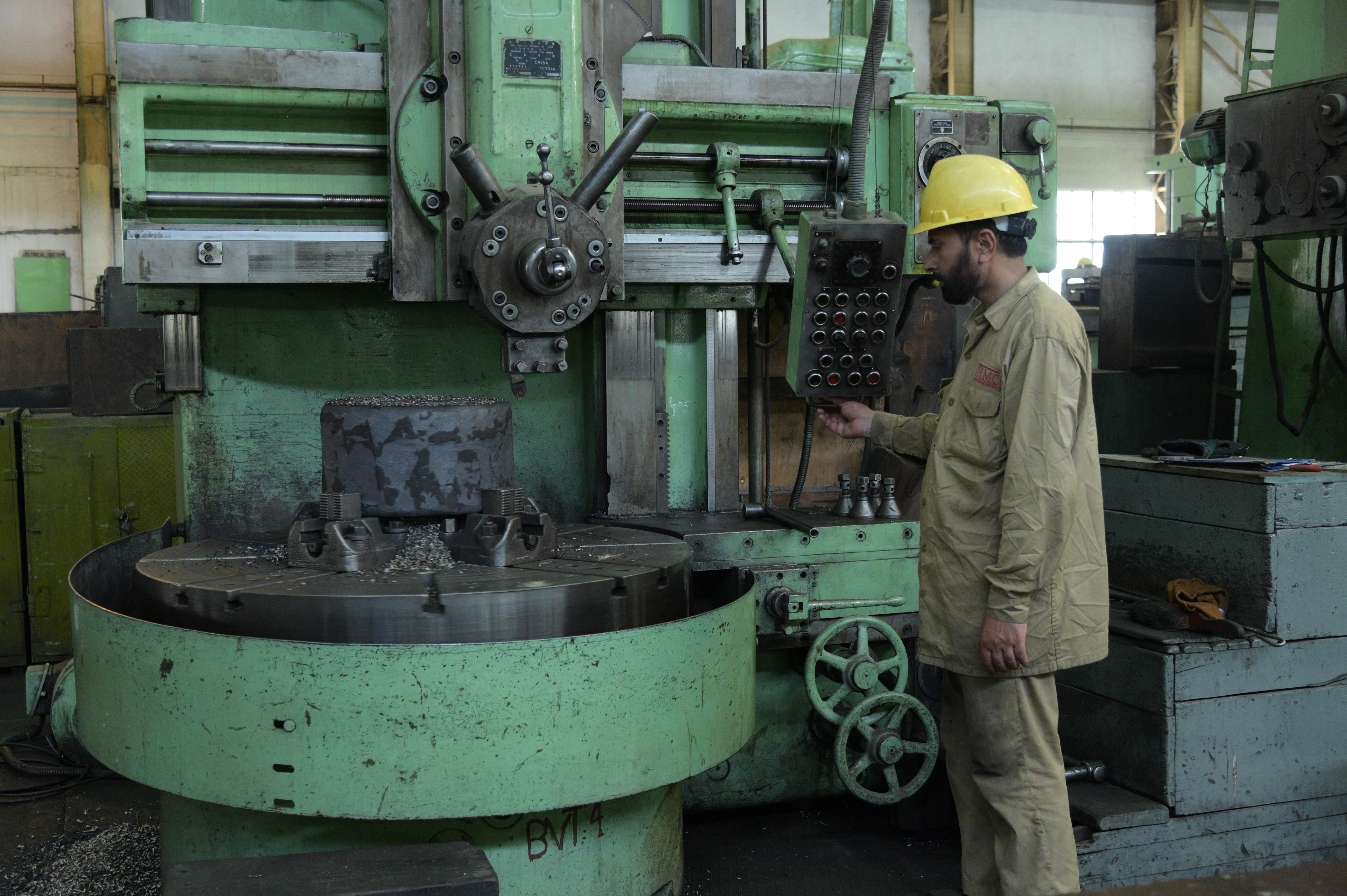 A man crushing iron remains