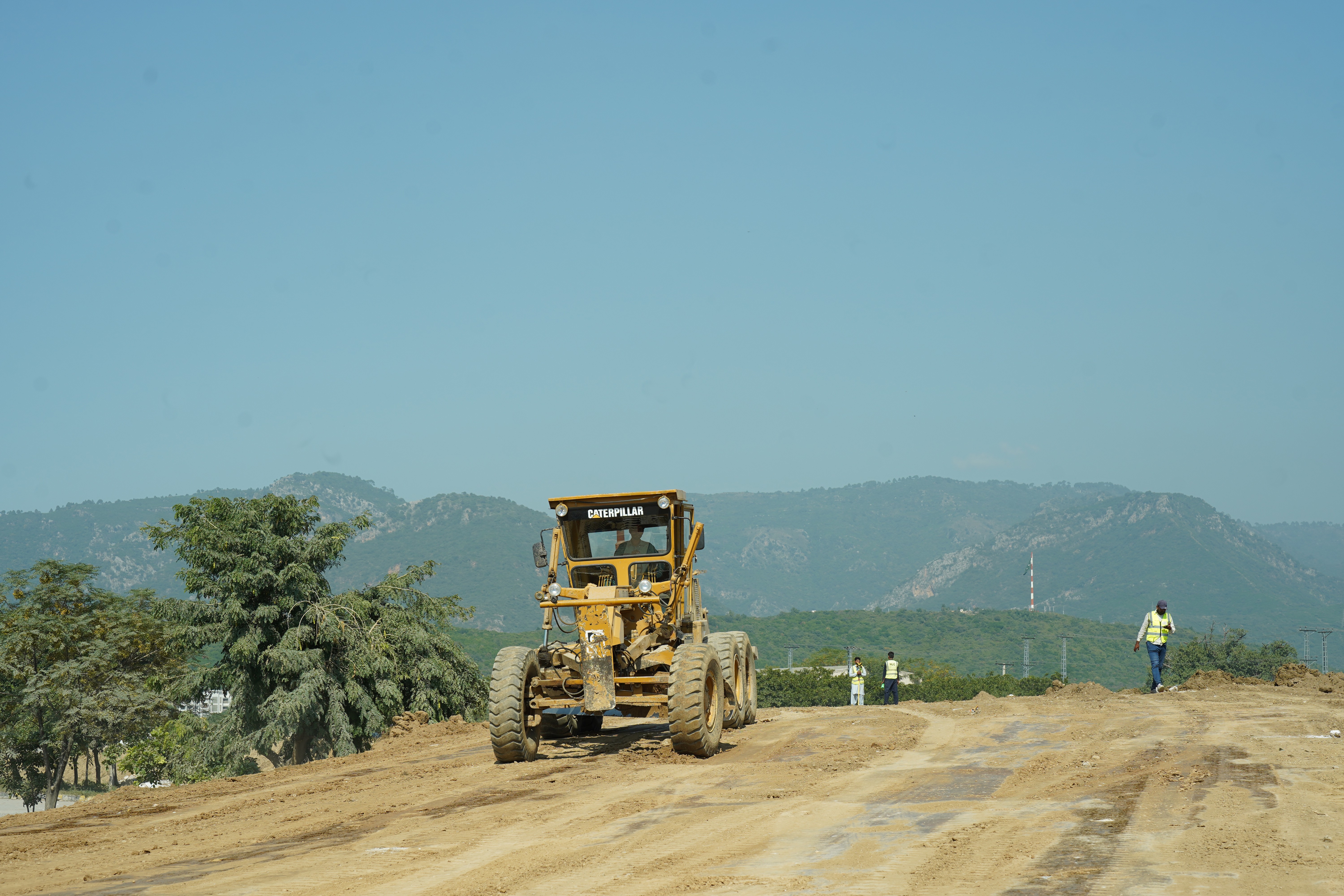 Heavy machinery deployed by the National Logistic Cell (NLC) at the construction site in the remote areas of Federal Capital of Pakistan