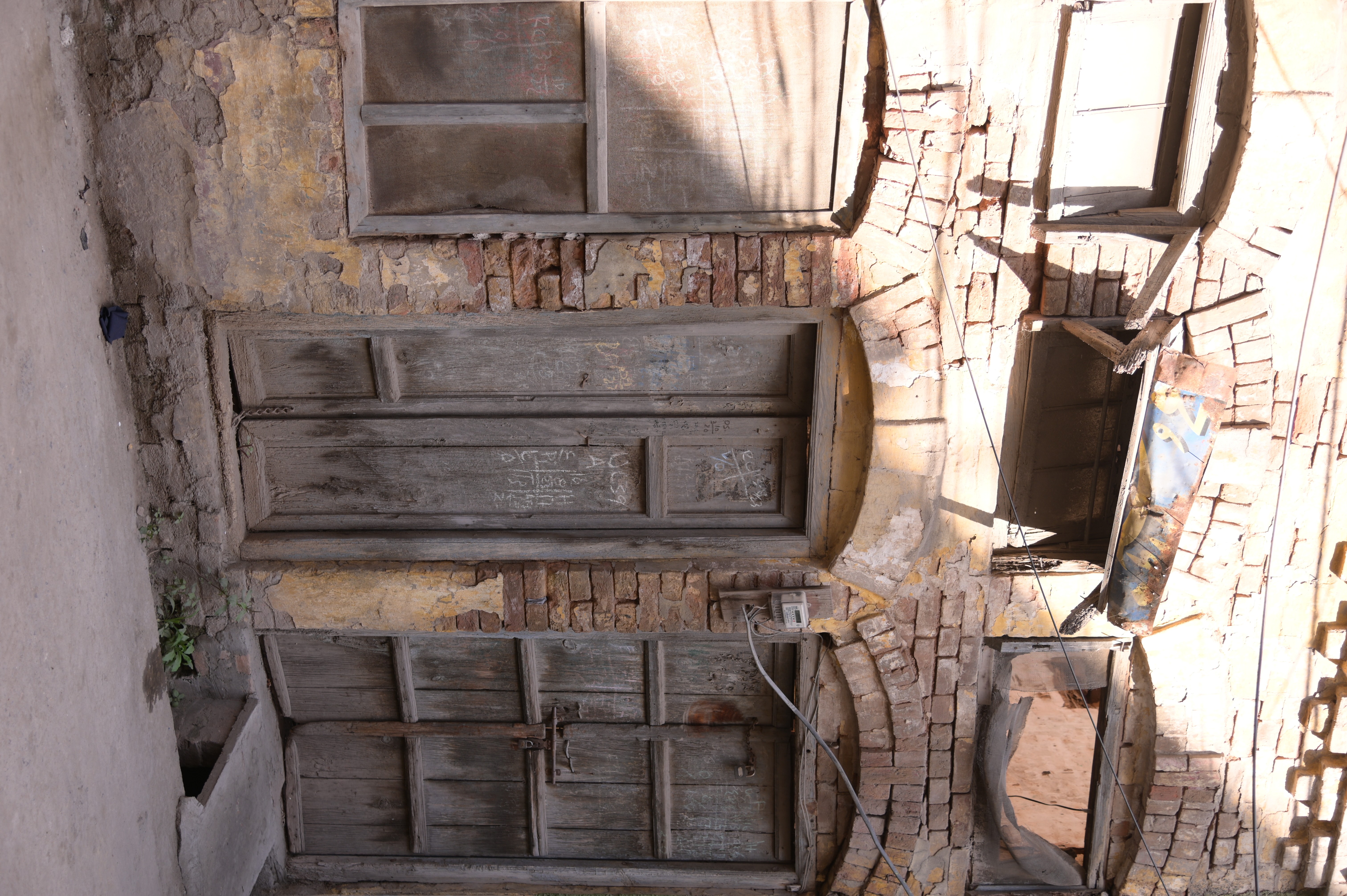 An old-fashioned house with wooden doors