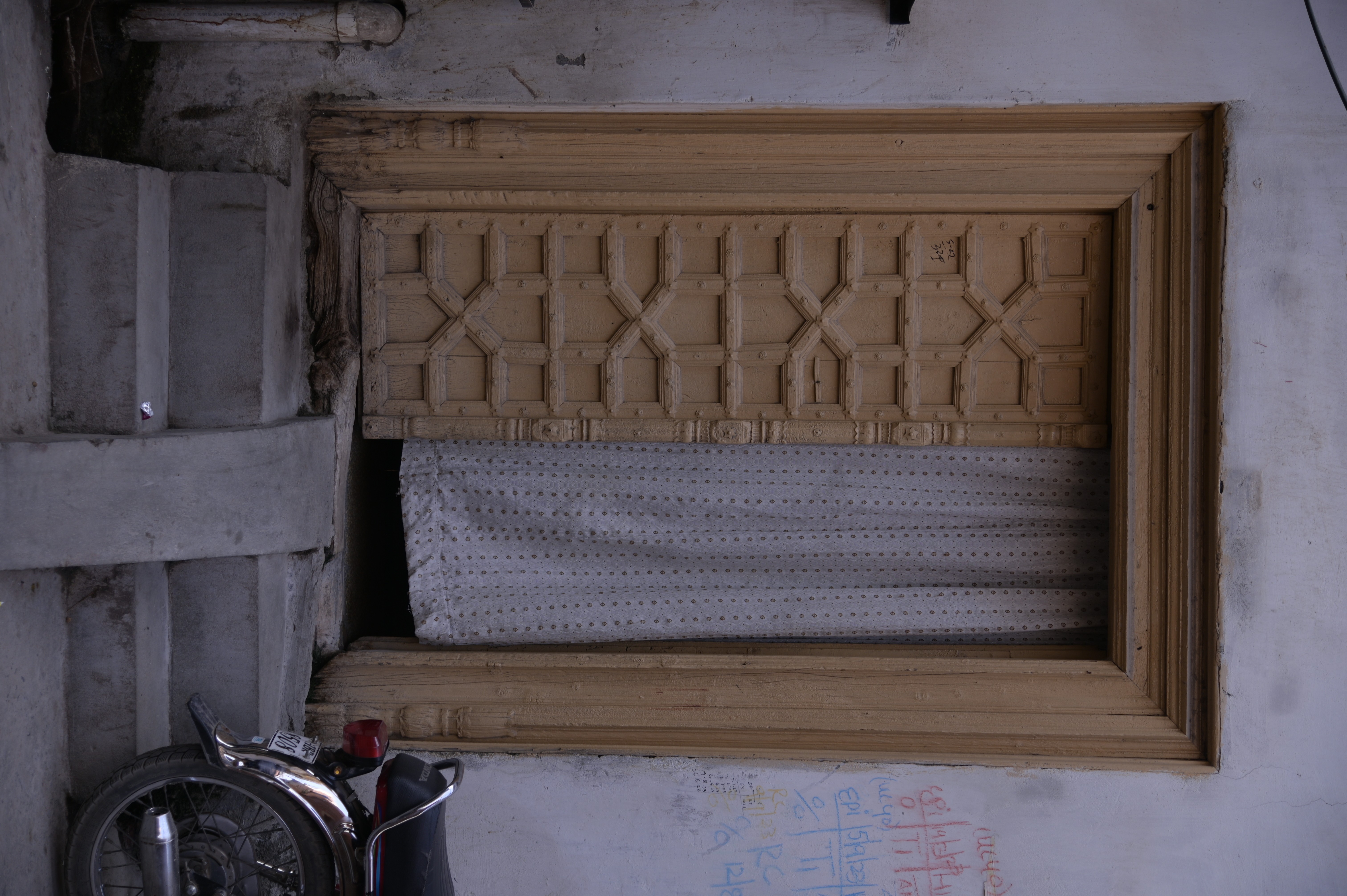 An old-fashioned house with wooden doors showing the ancient culture of Rawalpindi