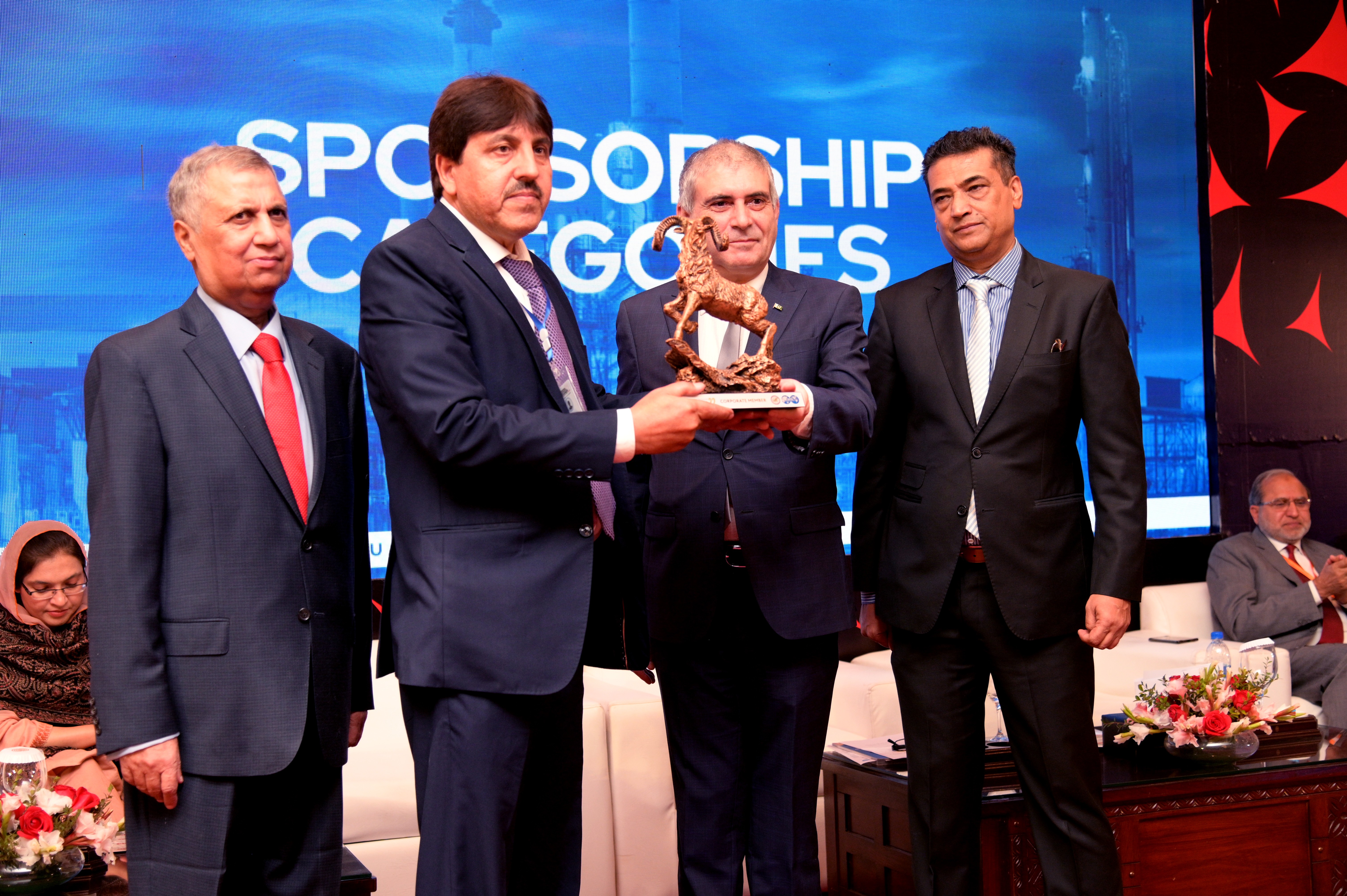 Shields distribution ceremony to the cooperate members at the event of conference and oil show