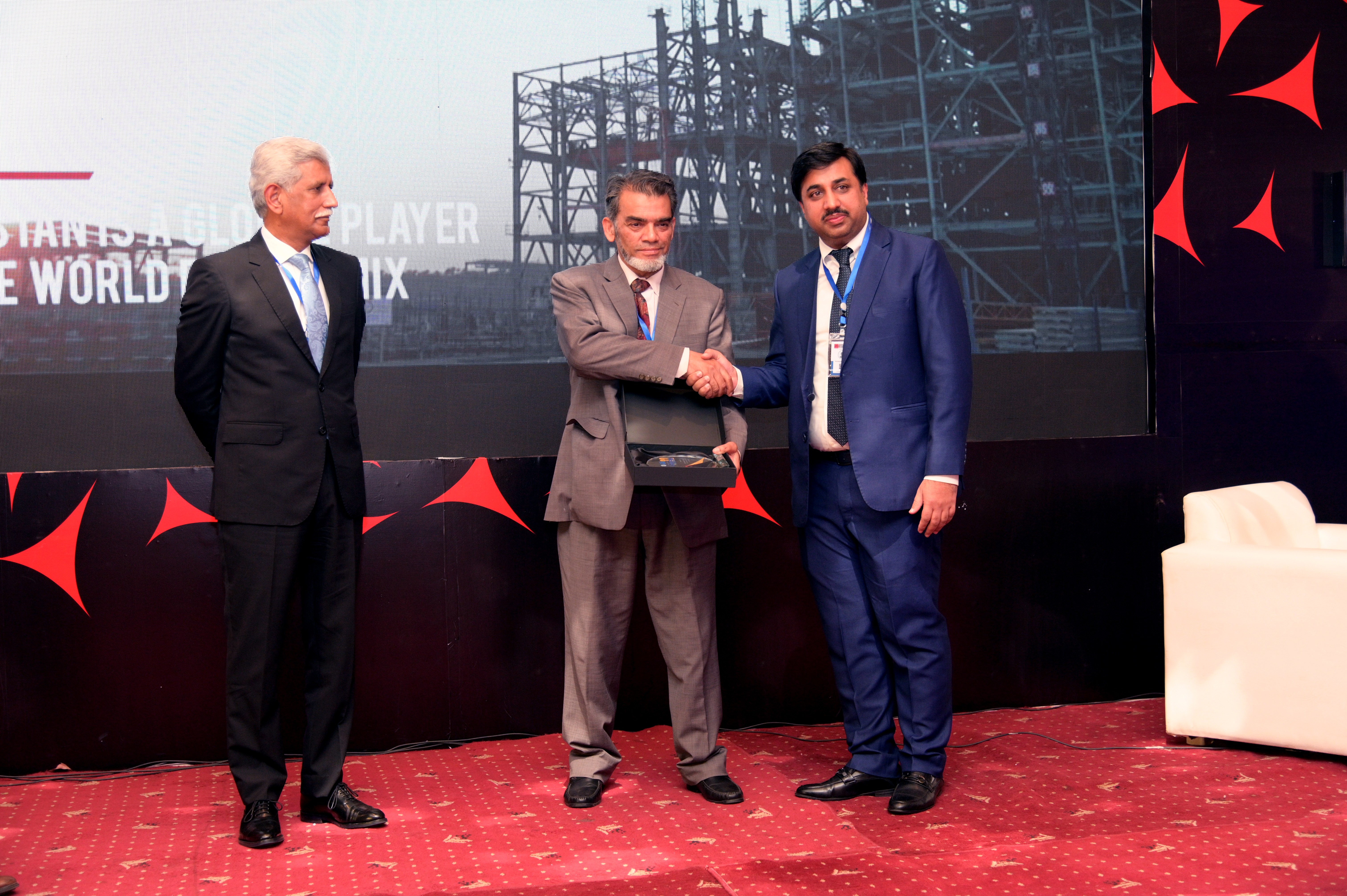 Shields distribution ceremony to the cooperate members at the event of conference and oil show