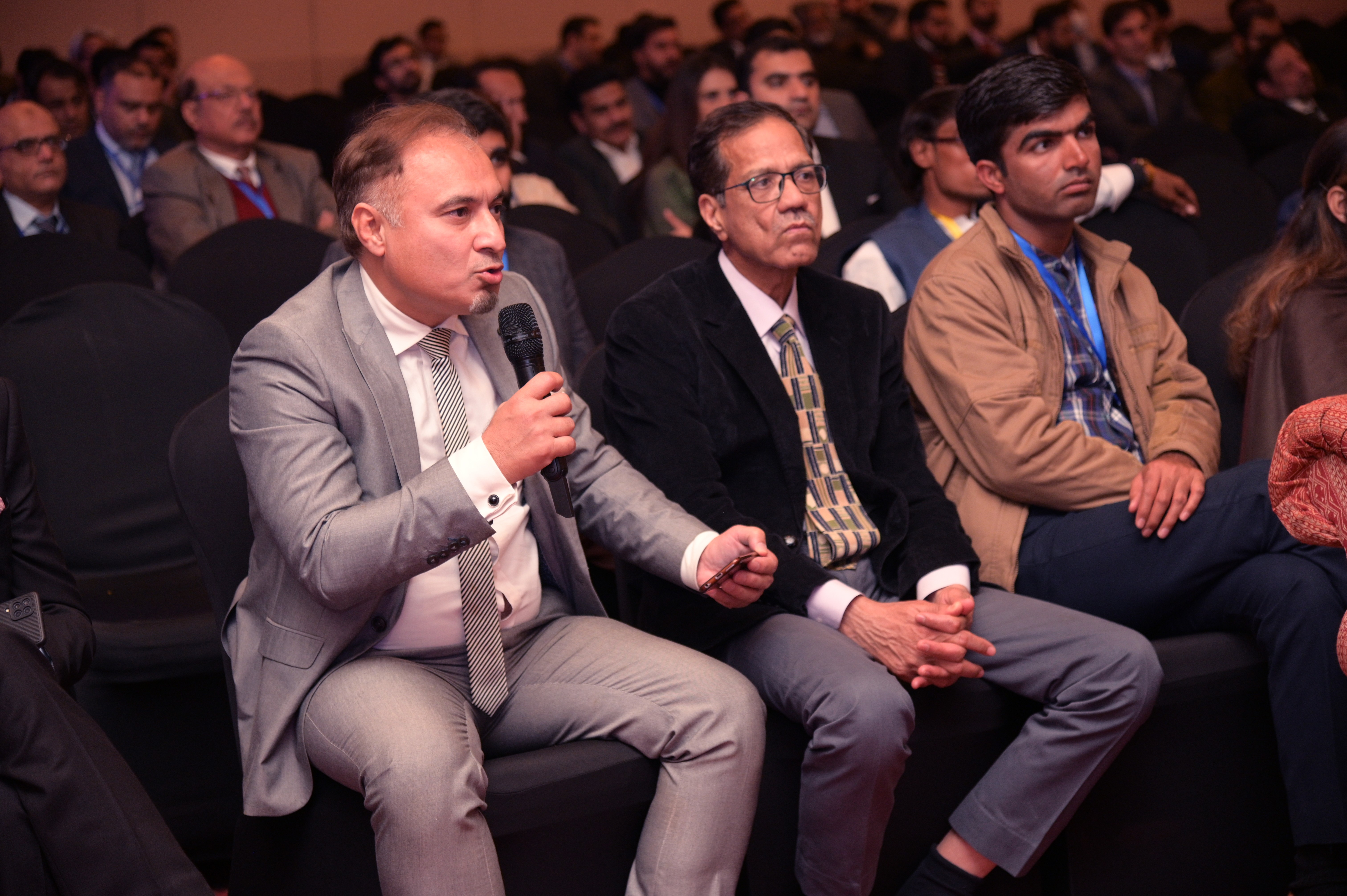 Members asking questions in the session during the conference