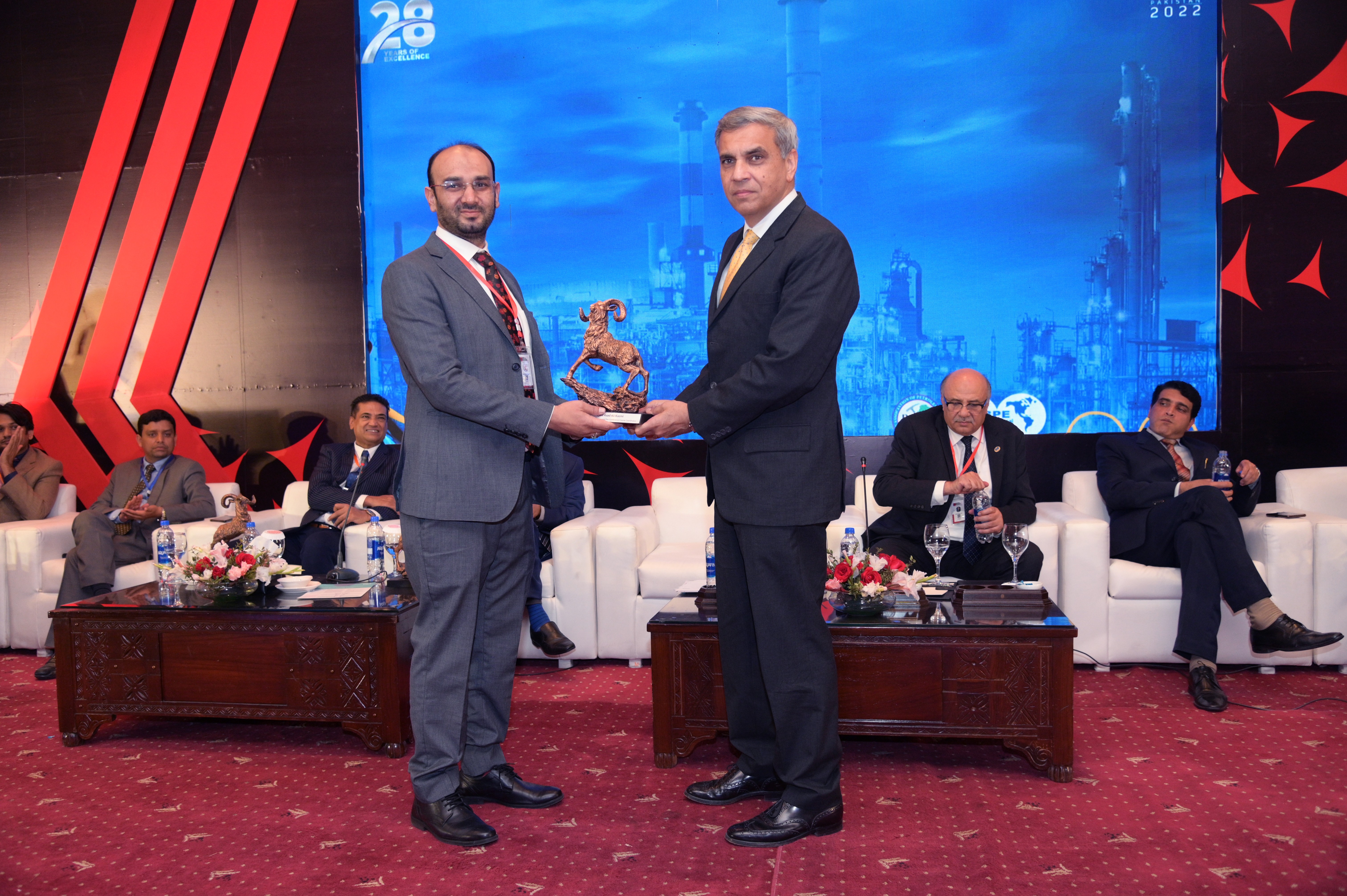 Shields distribution ceremony to the cooperate members at the event of conference and oil show