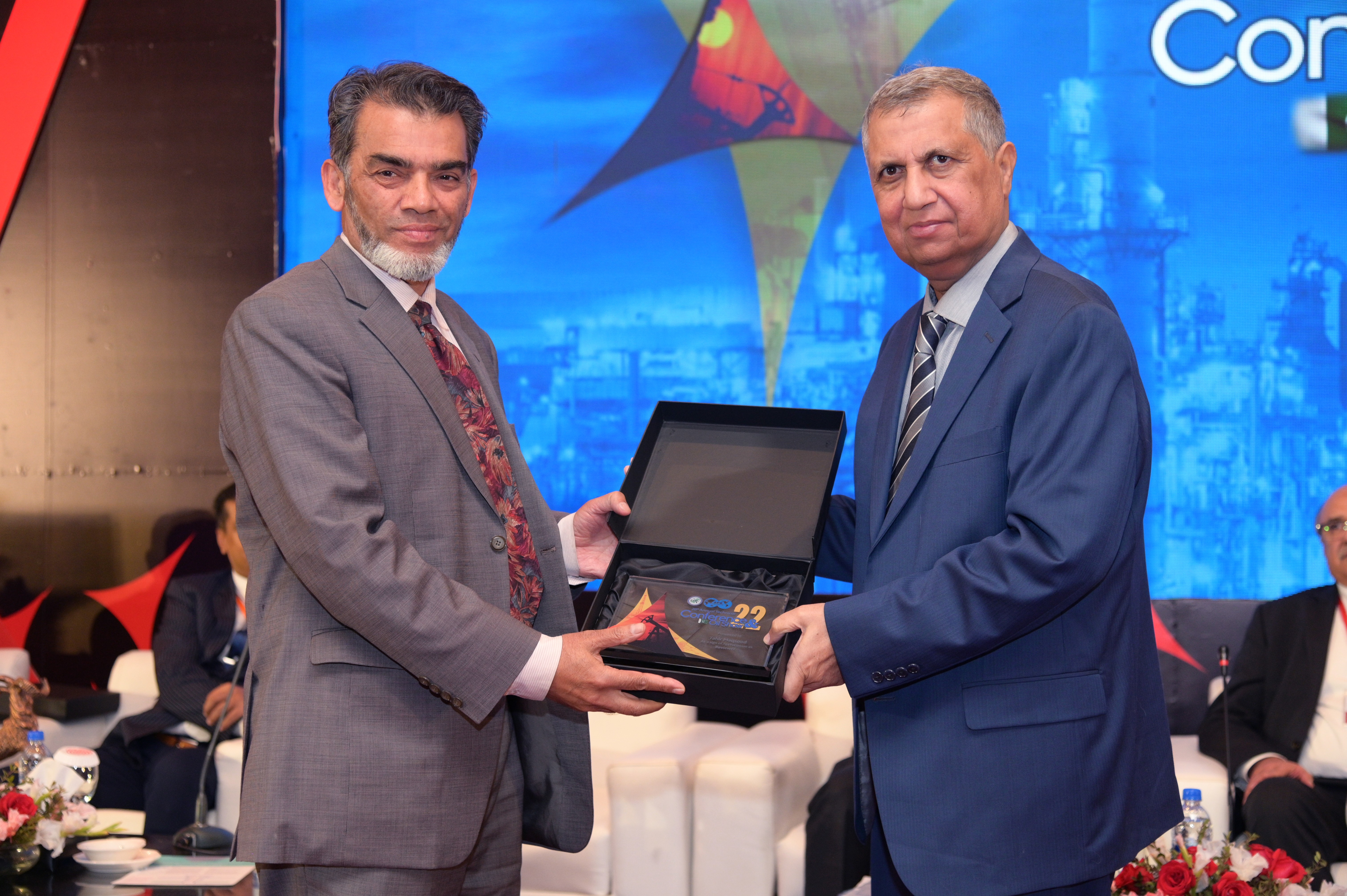 Shields distribution ceremony to the cooperate members at the event of conference and oil show