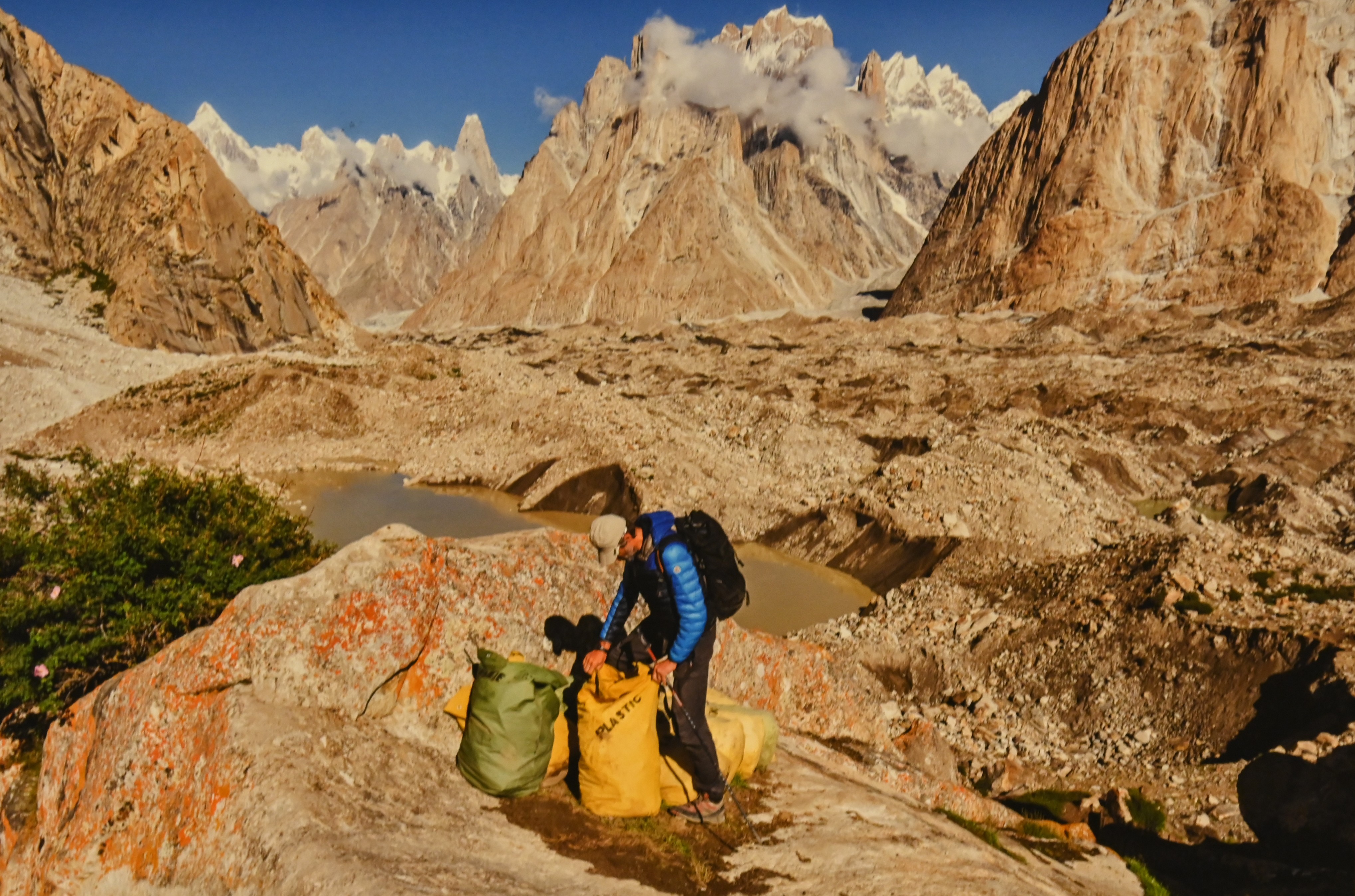 A volunteer collecting  plastic waste from the mountain region to keep it clean