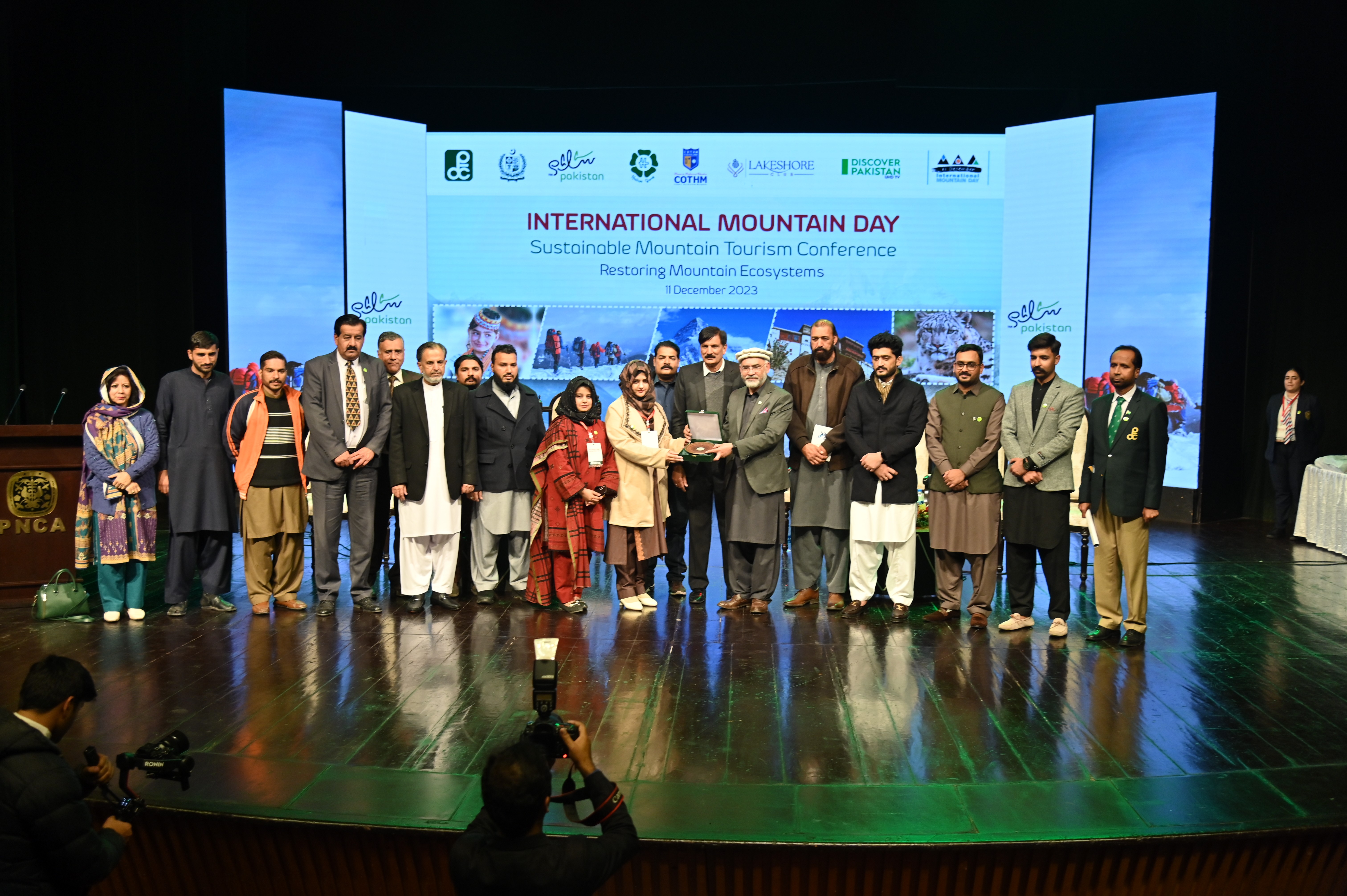 The group photo of the participants with the chief guests on International Mountain Day at PNCA