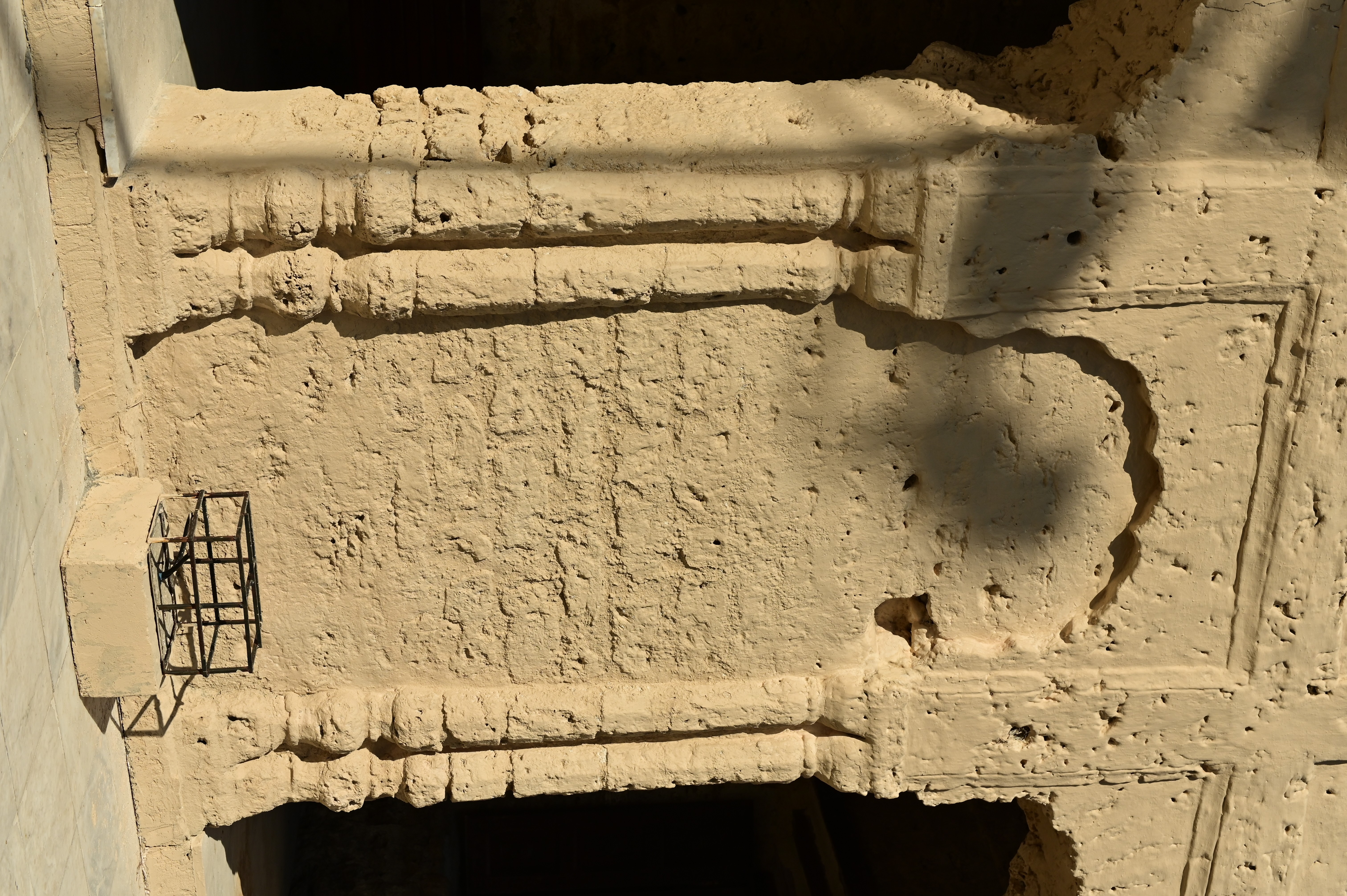 The old and deteriorated wall of the Temple located at Katas Raj