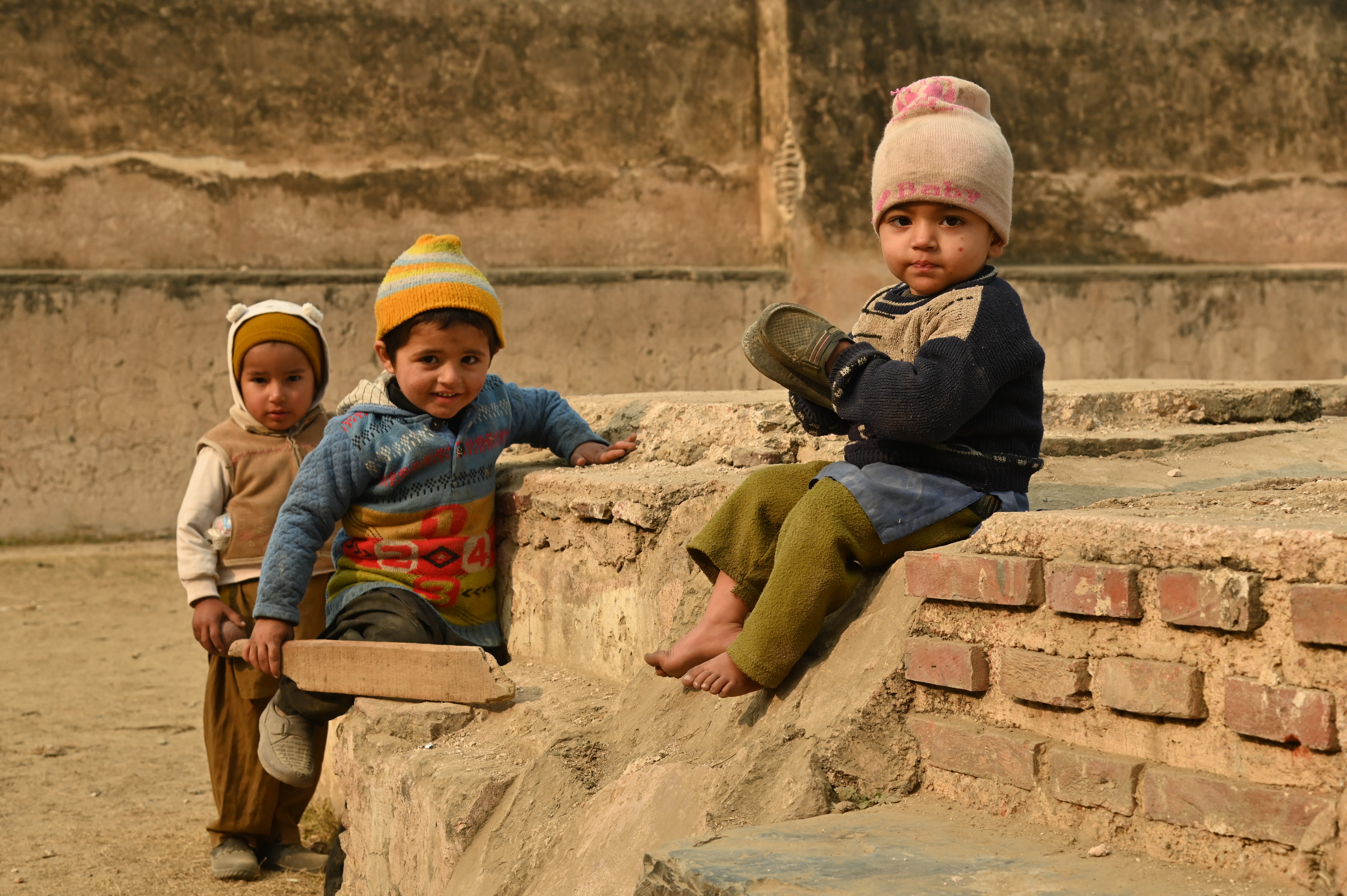 Children playing near the beautiful site "Behram ki Baradari"