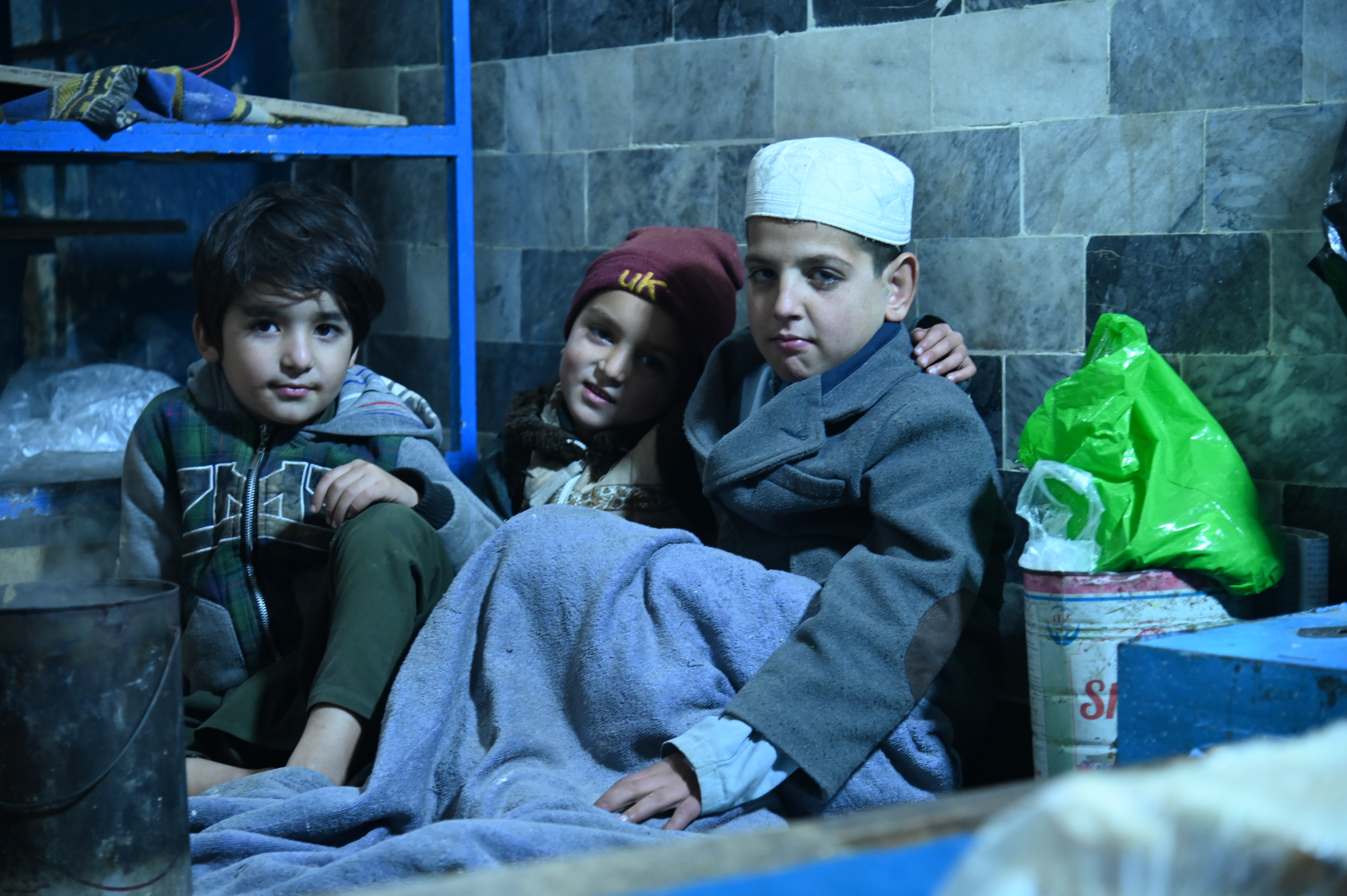 Children sitting inside the shop