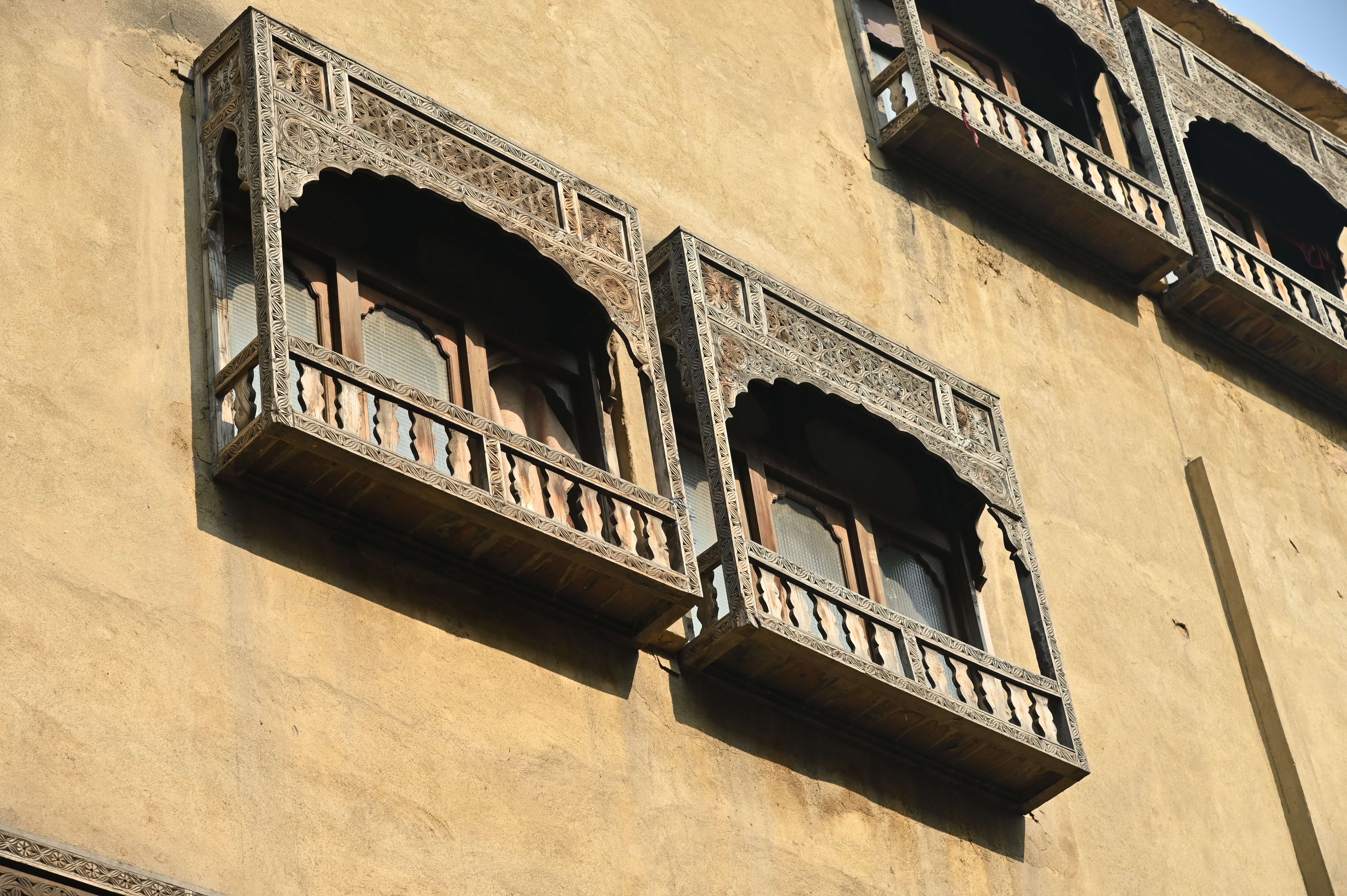 An old fashioned wooden window depicting the ancient culture