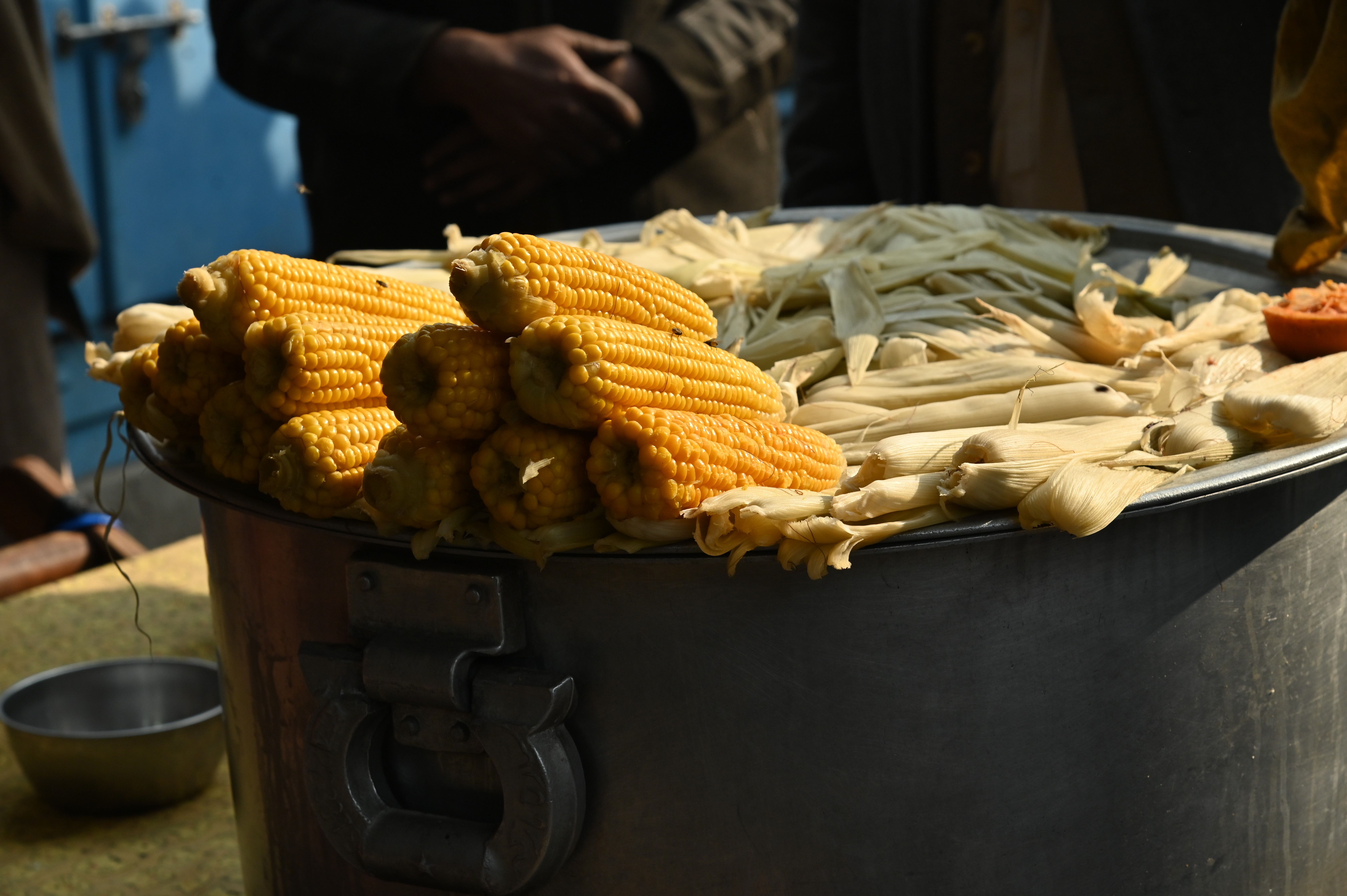 A man selling boiled corns