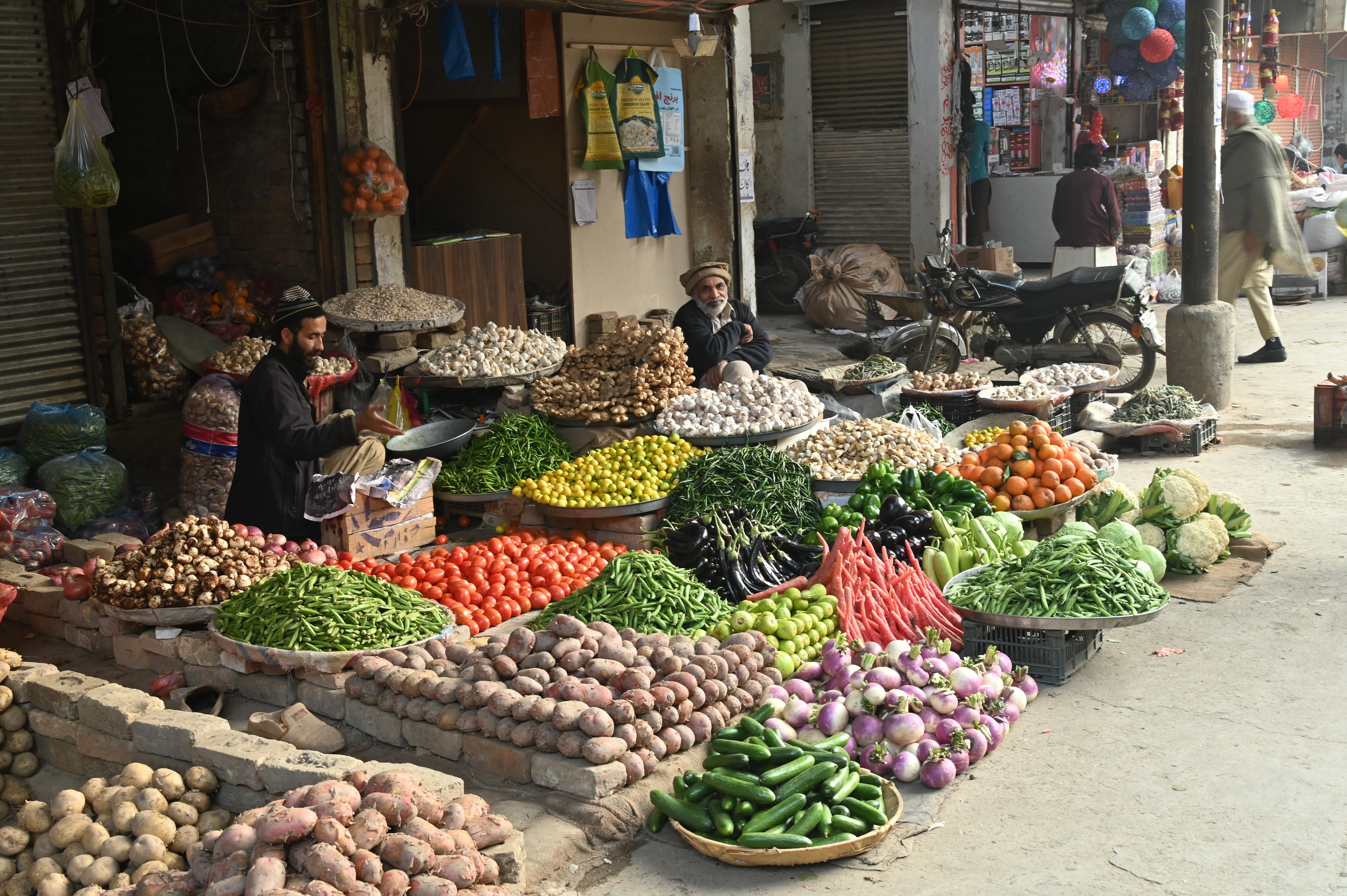 A man selling fresh vegetables in a stall in Weekly Bazaar