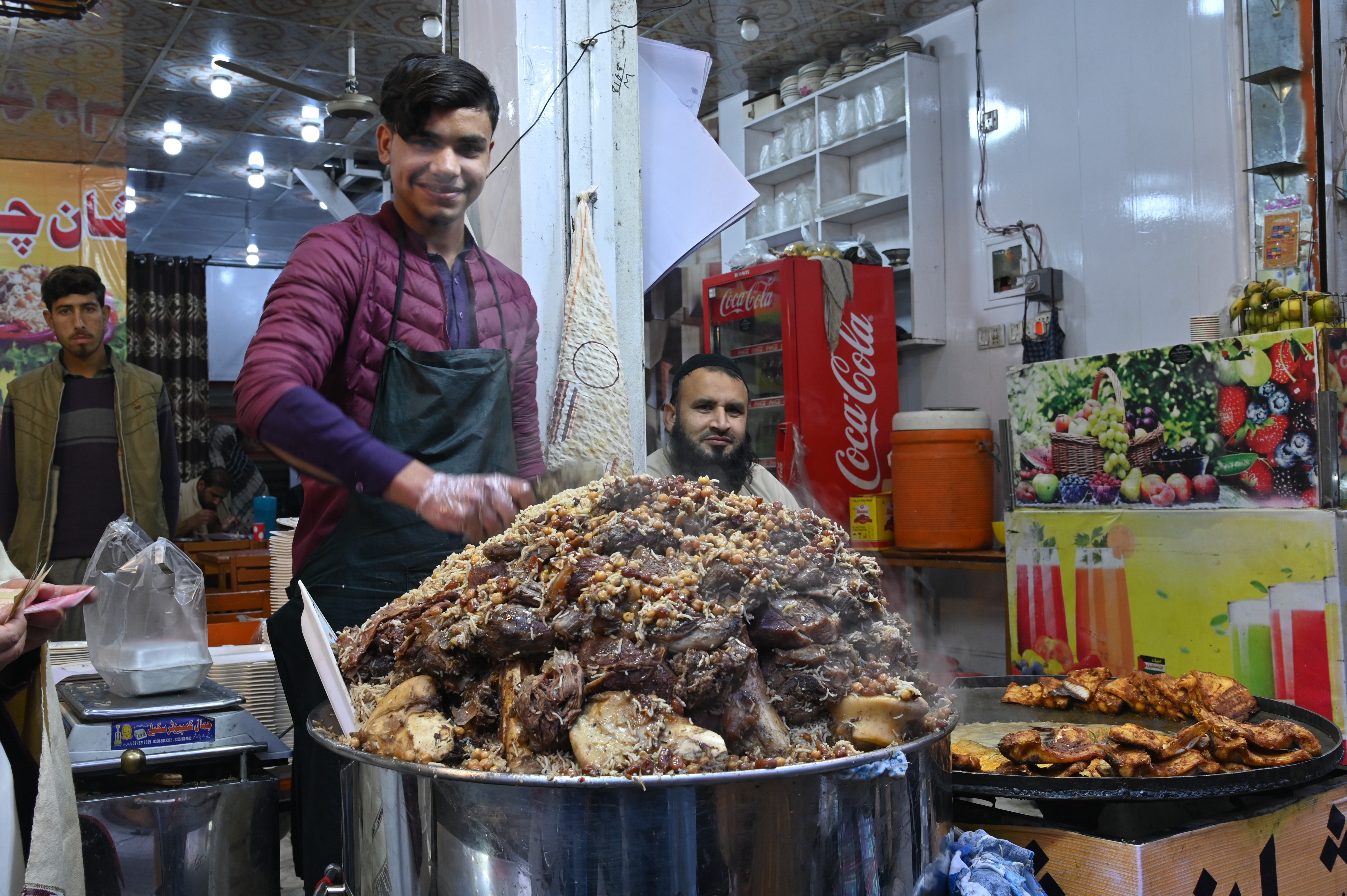 A boy selling Kabuli Pulao, The Afghan National Dish