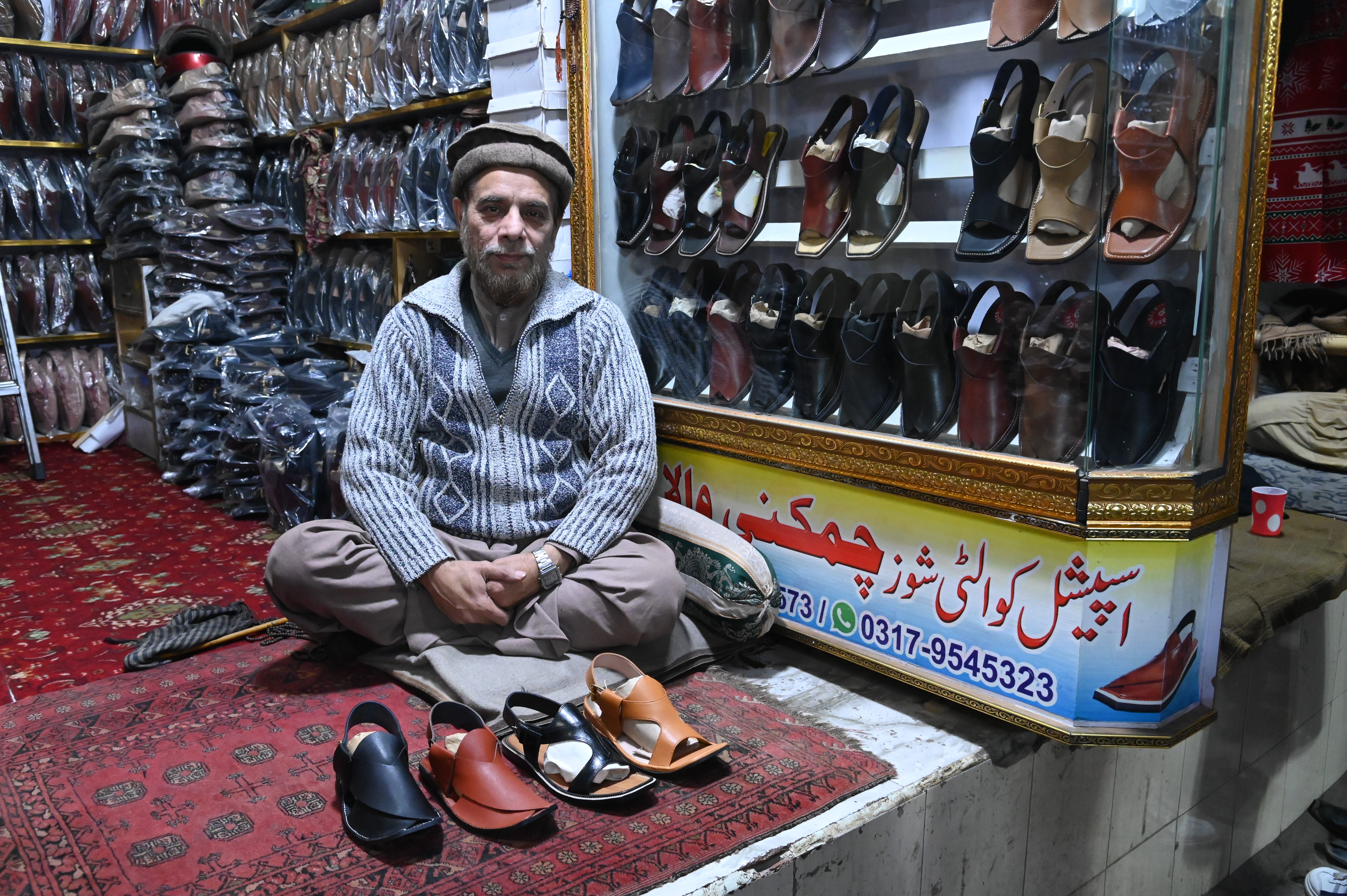 A man selling Kheri, one of the leading handmade footwear