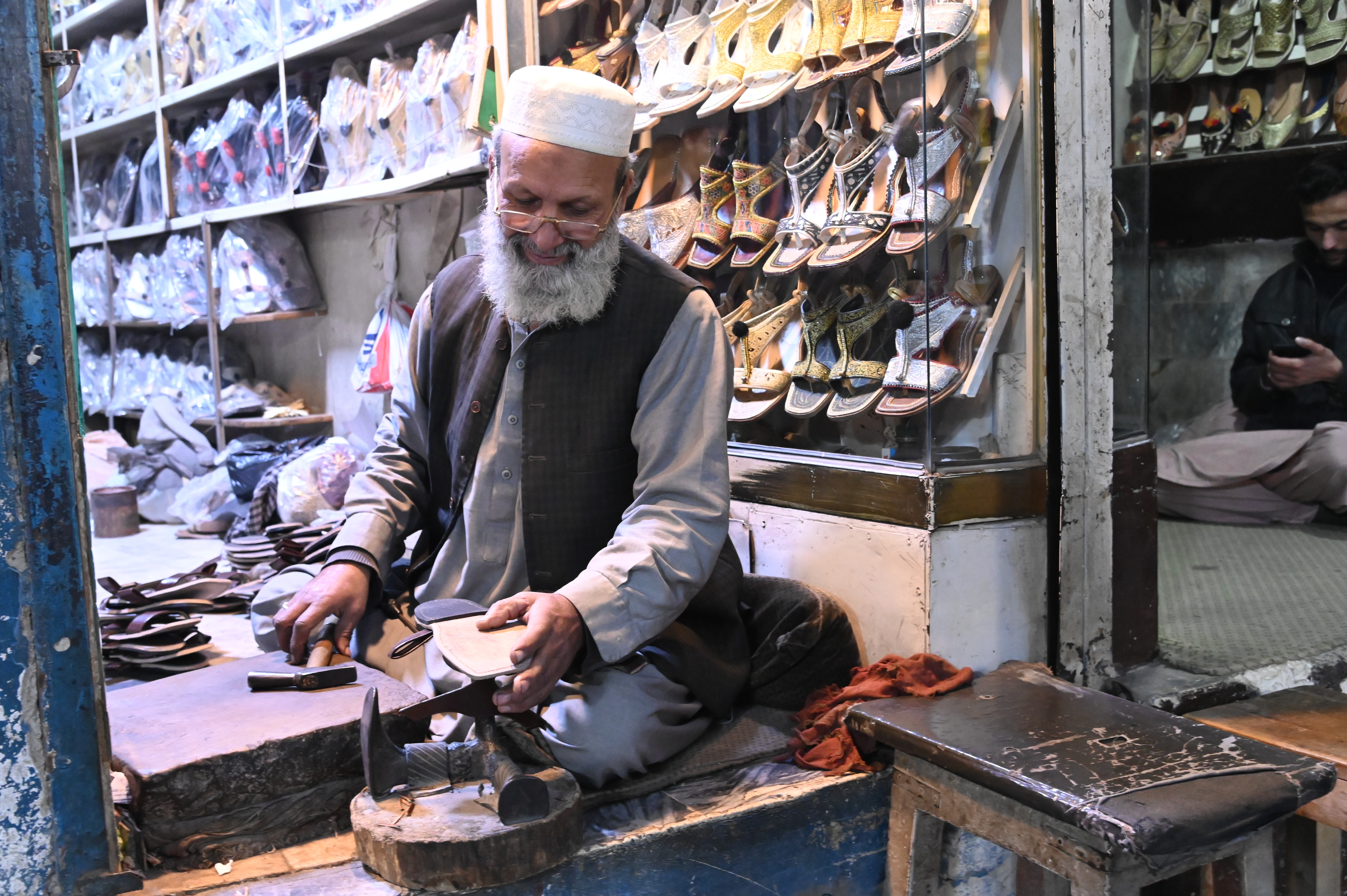 A shoemaker making Traditional Kheri of Peshawar