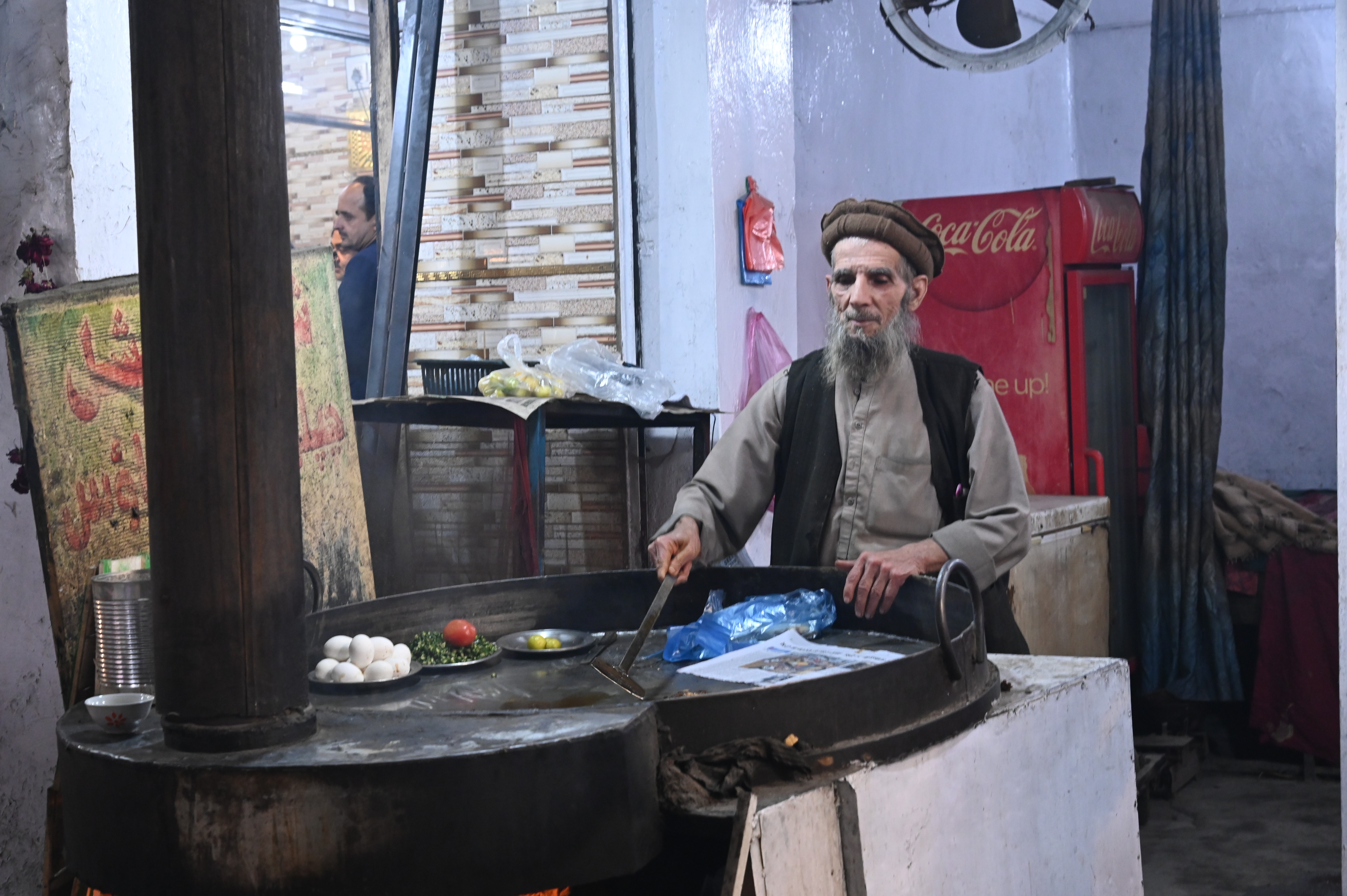 A man selling Chapli Kebab
