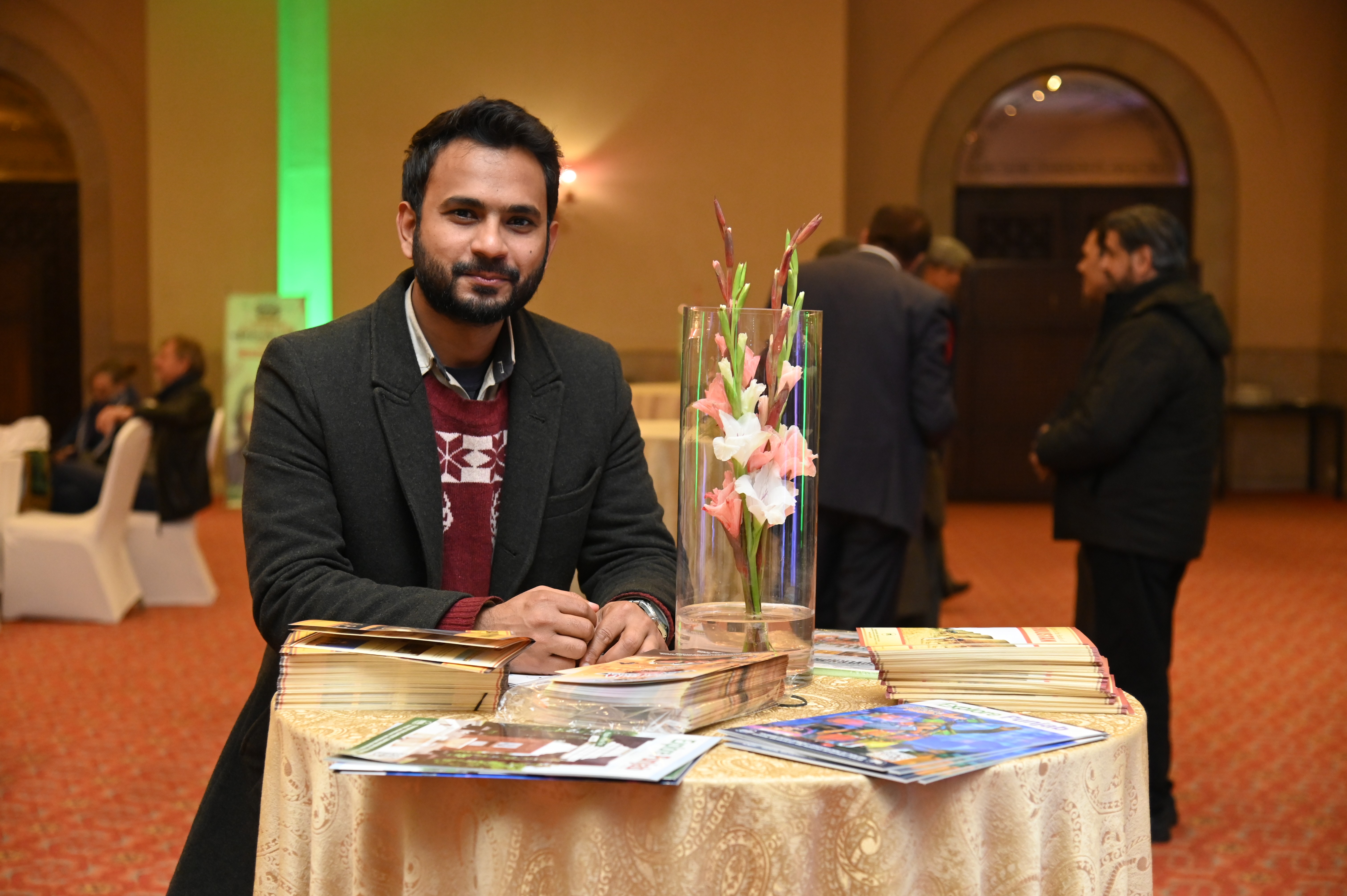 A participants having brochures of the event