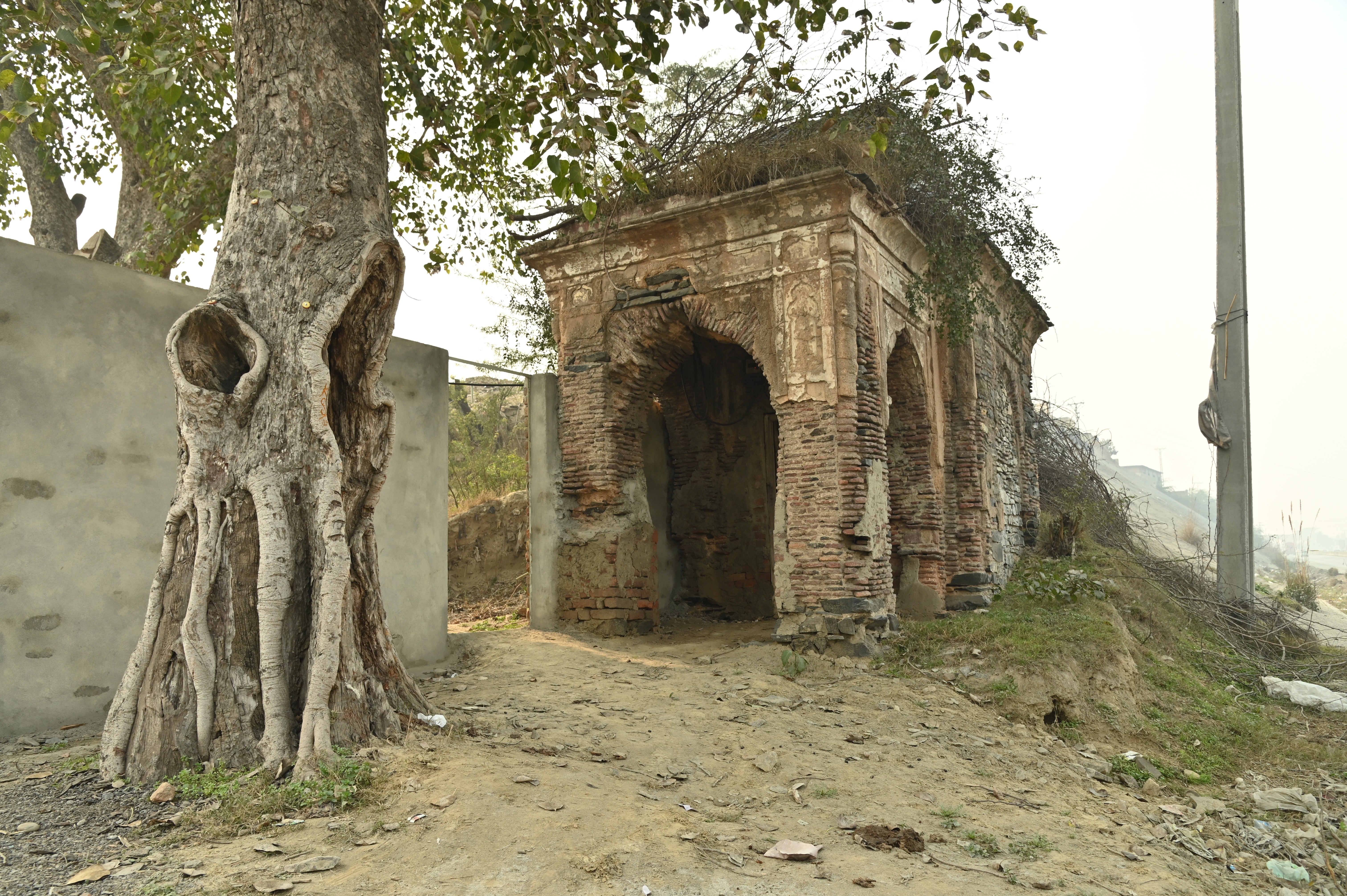 The deteriorated and crumbling beauty of the ancient structure near The Attock Tomb