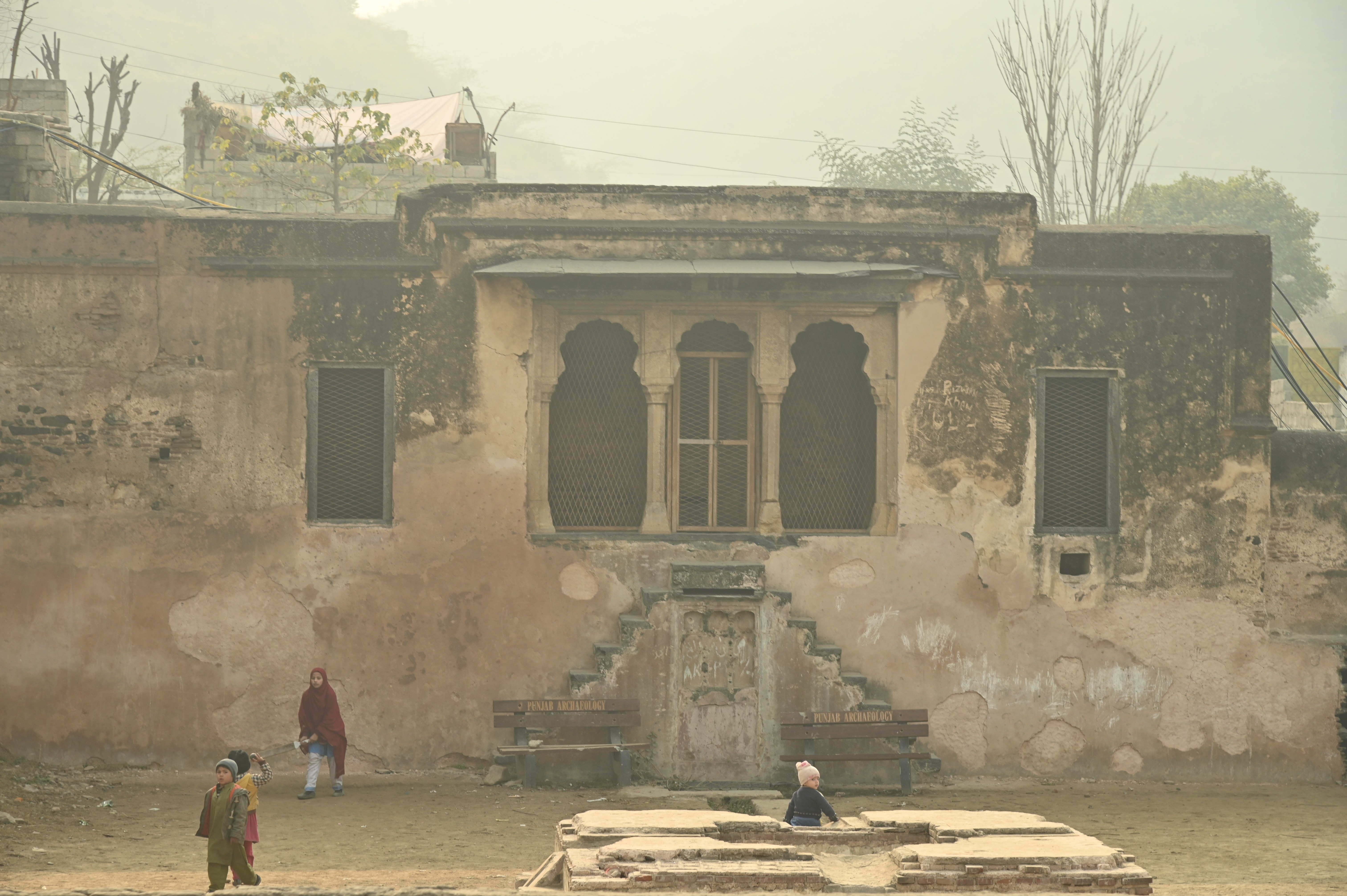 Children playing near the beautiful site "Behram ki Baradari"