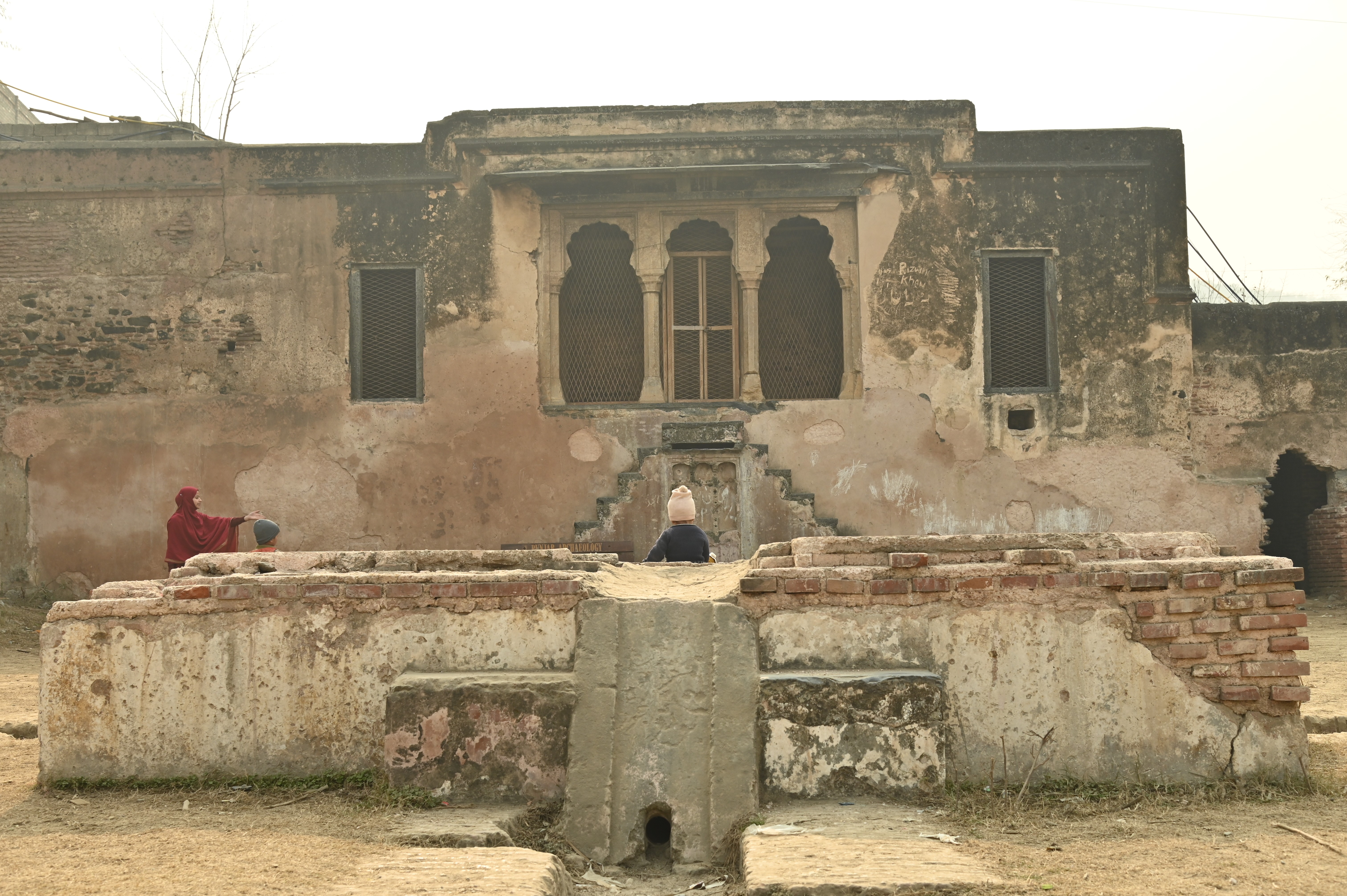 Children playing near the beautiful site "Behram ki Baradari"