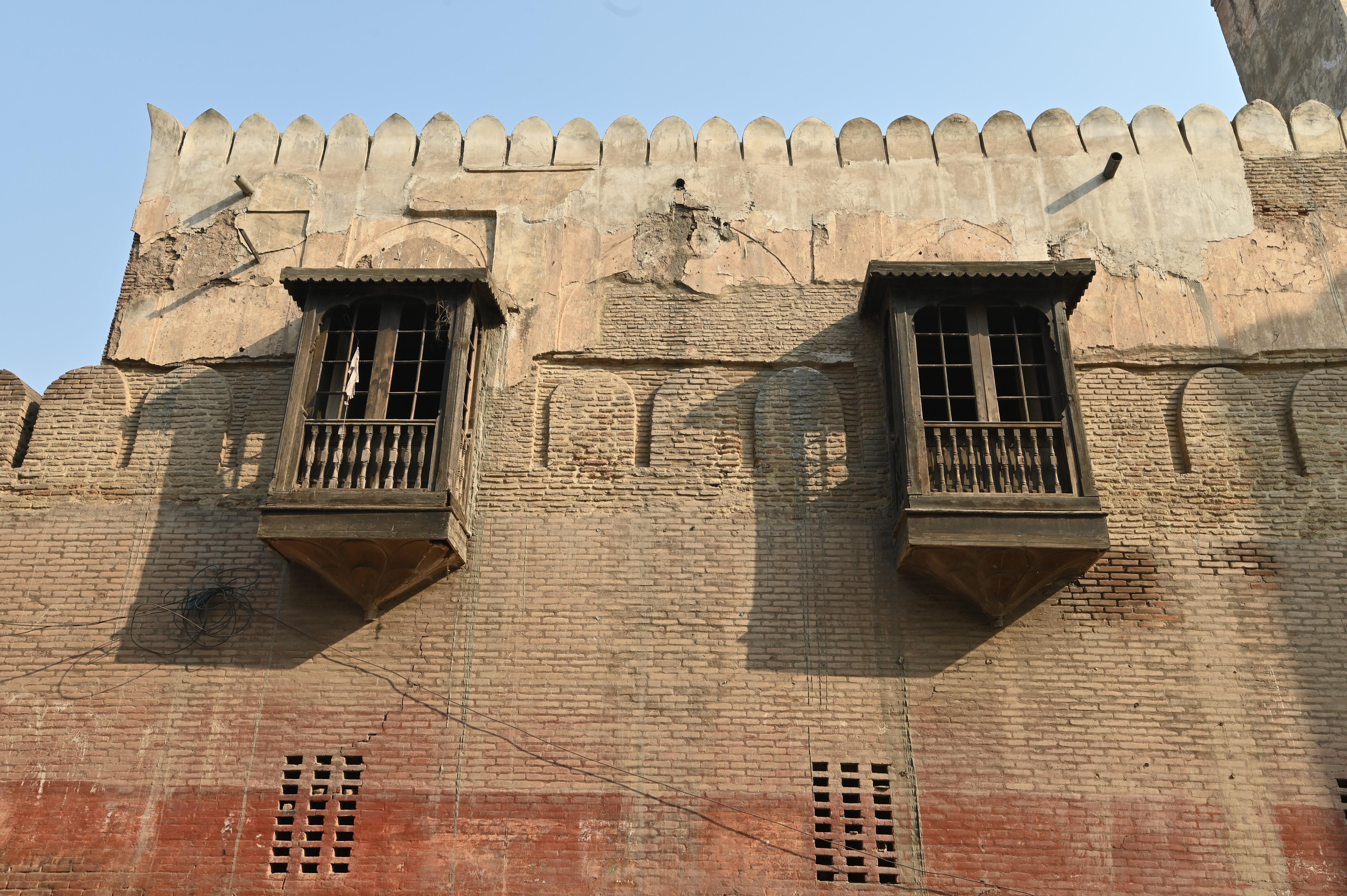 An old fashioned wooden window depicting the ancient culture