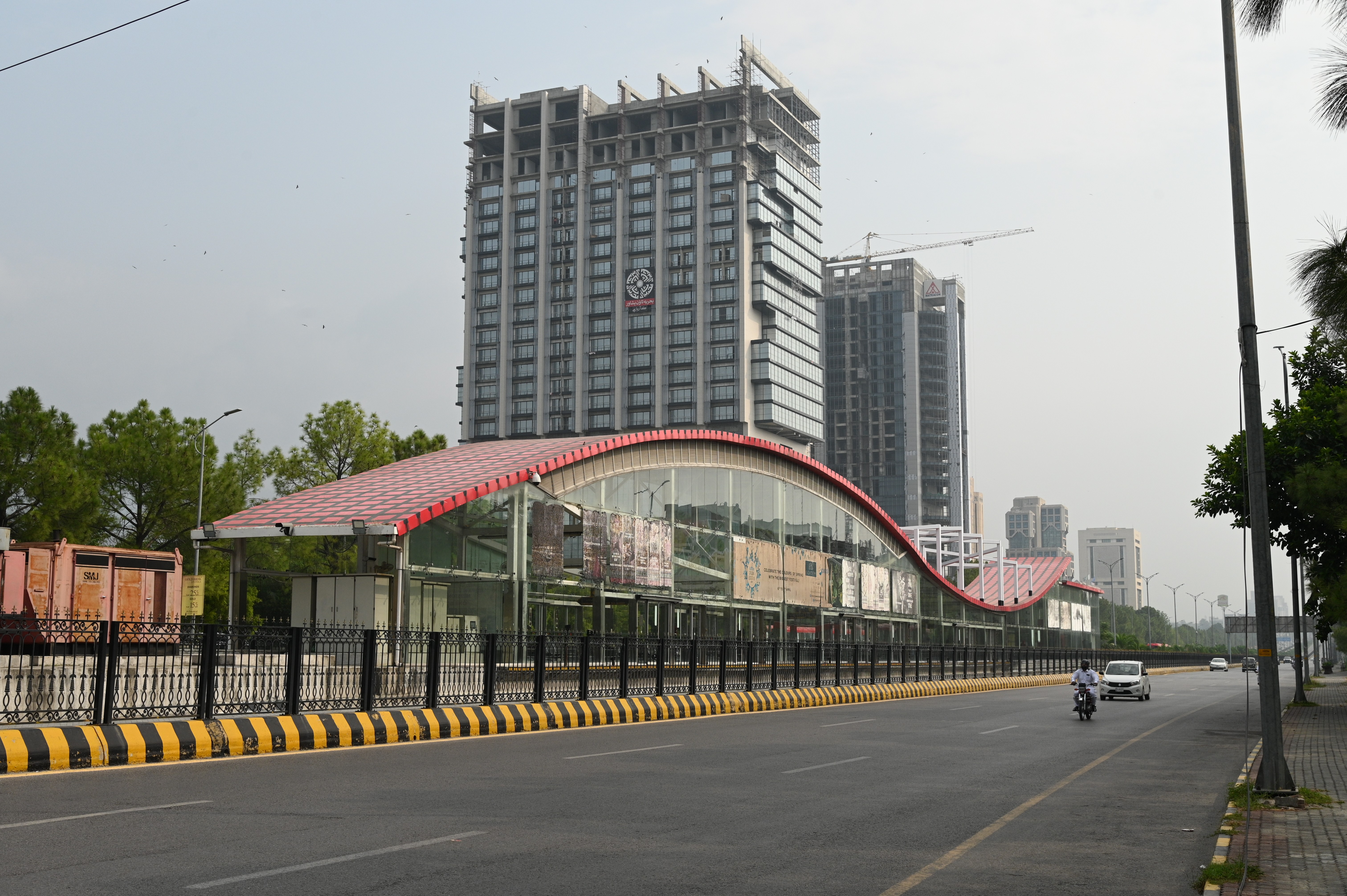 A beautiful view of high rise buildings in blue area along with the metro track