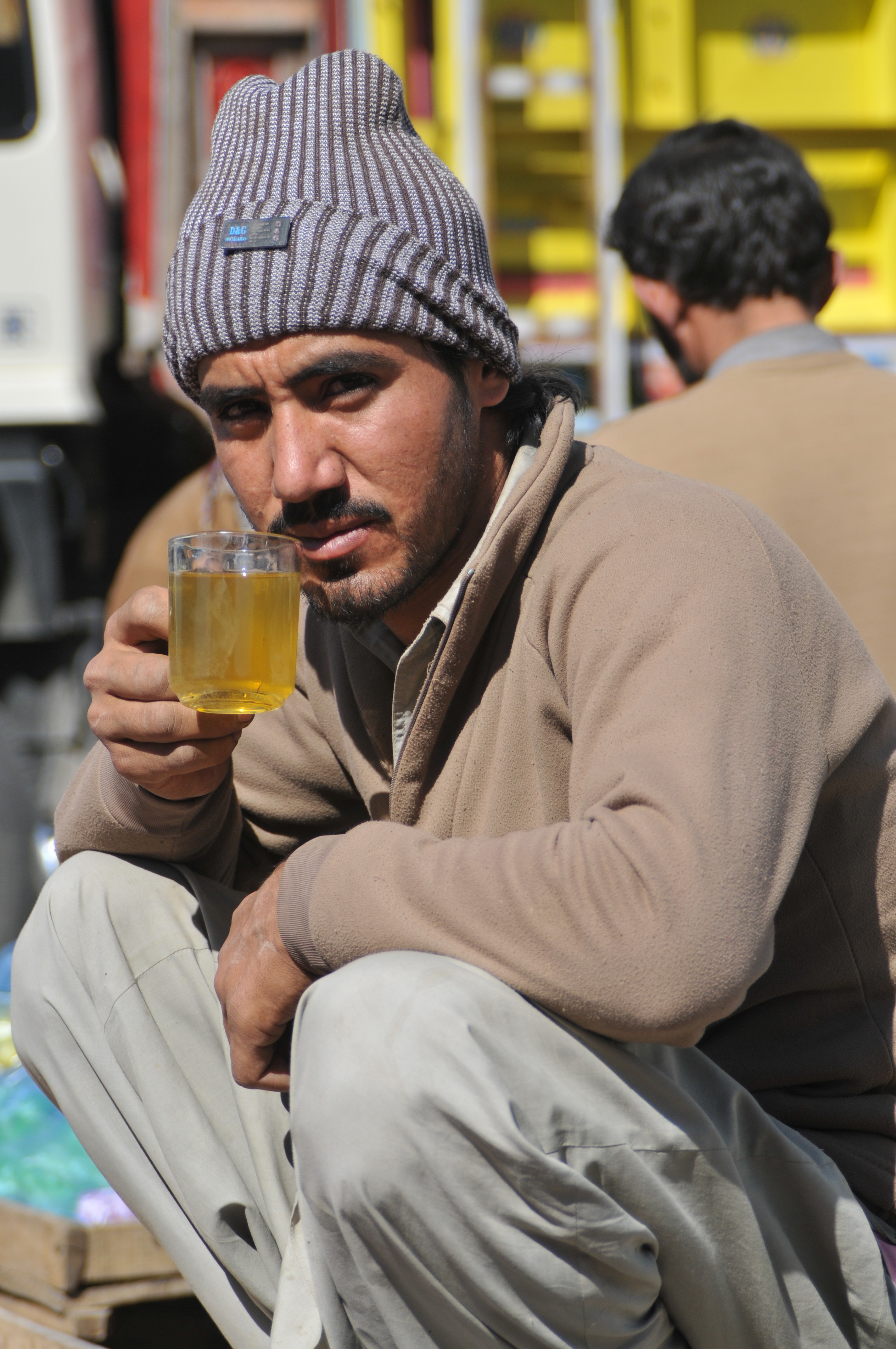 A man having a cup of green tea