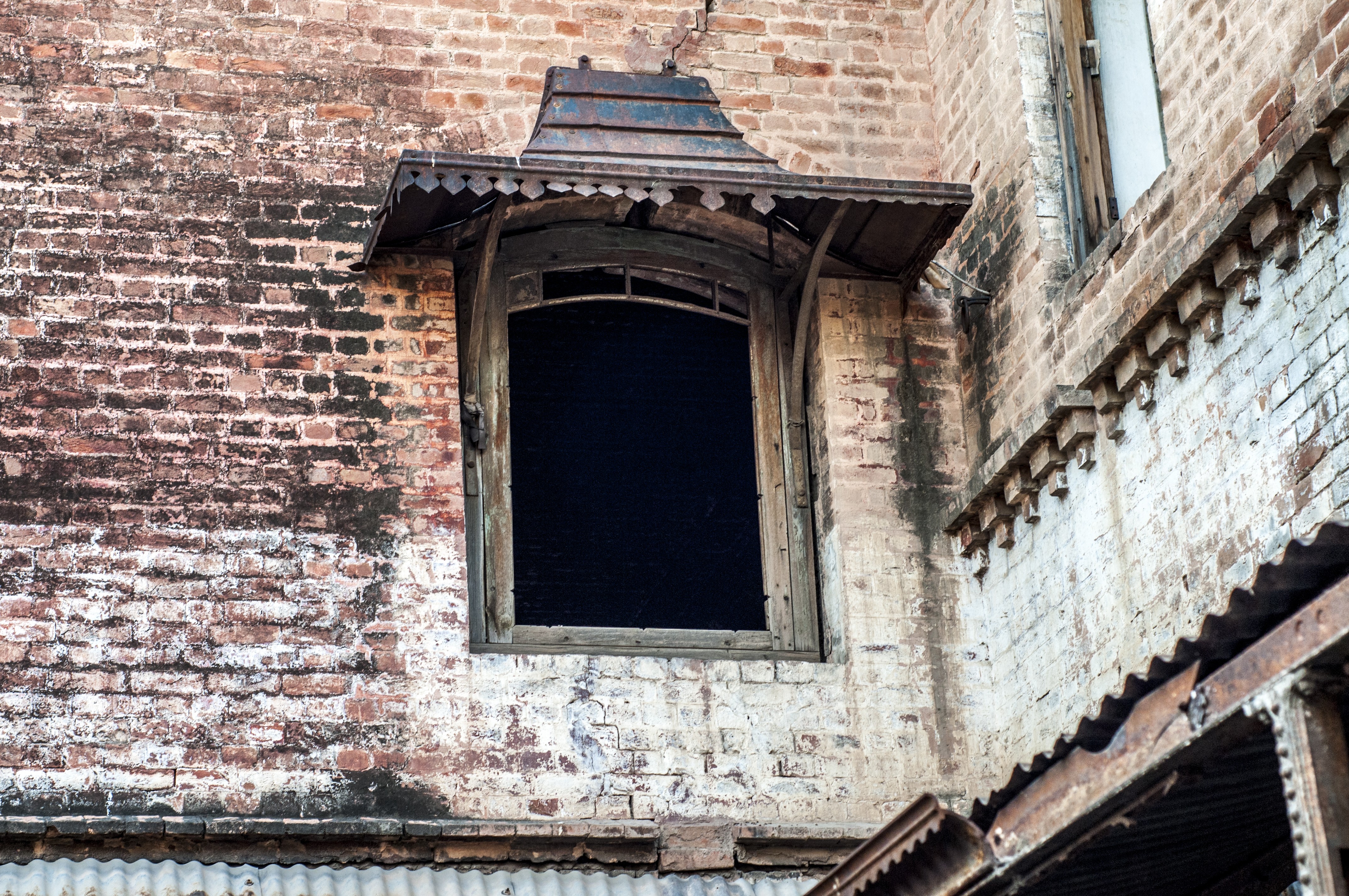 The ancient building with wooden window