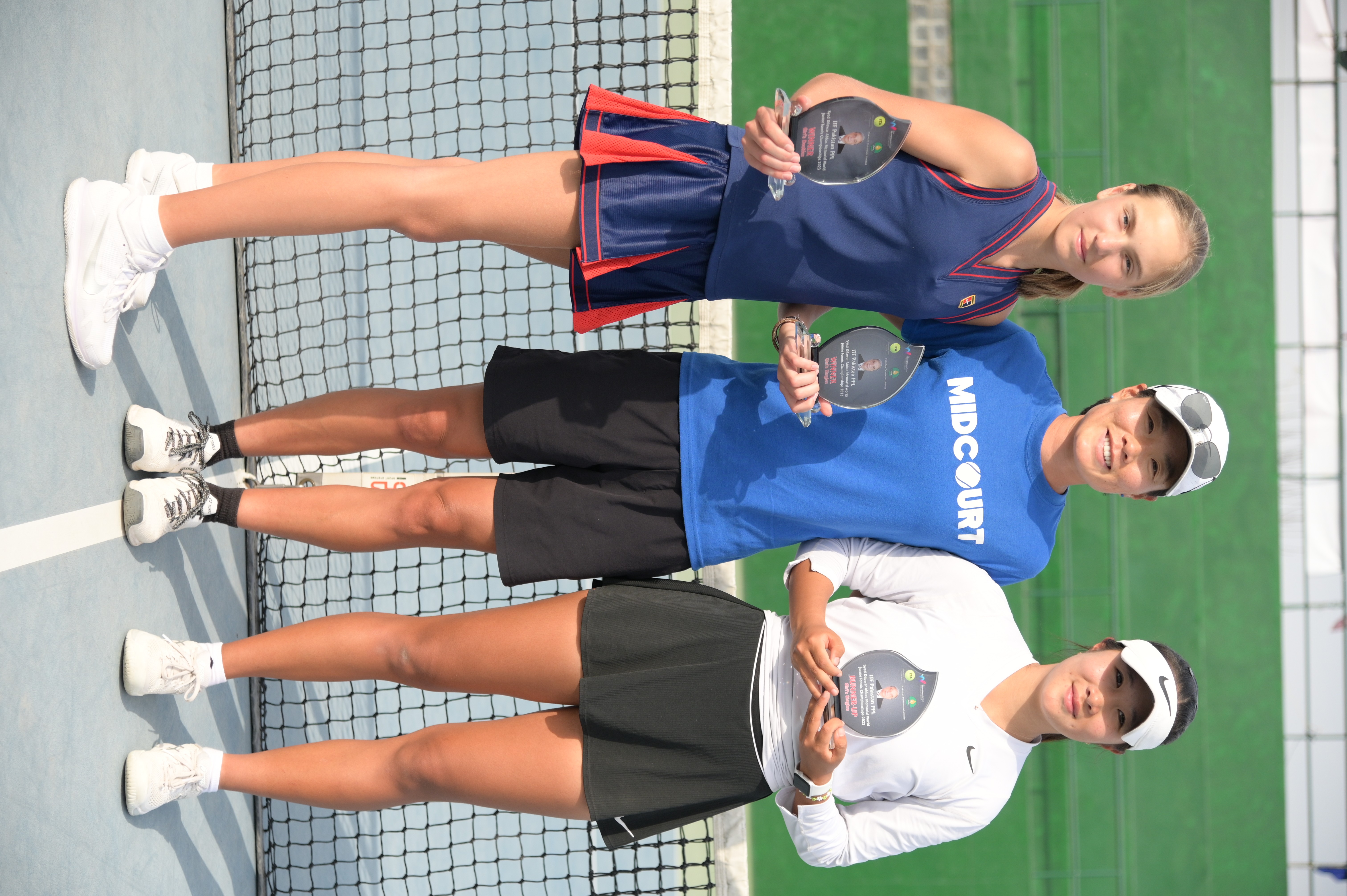 A group photo of winning tennis players