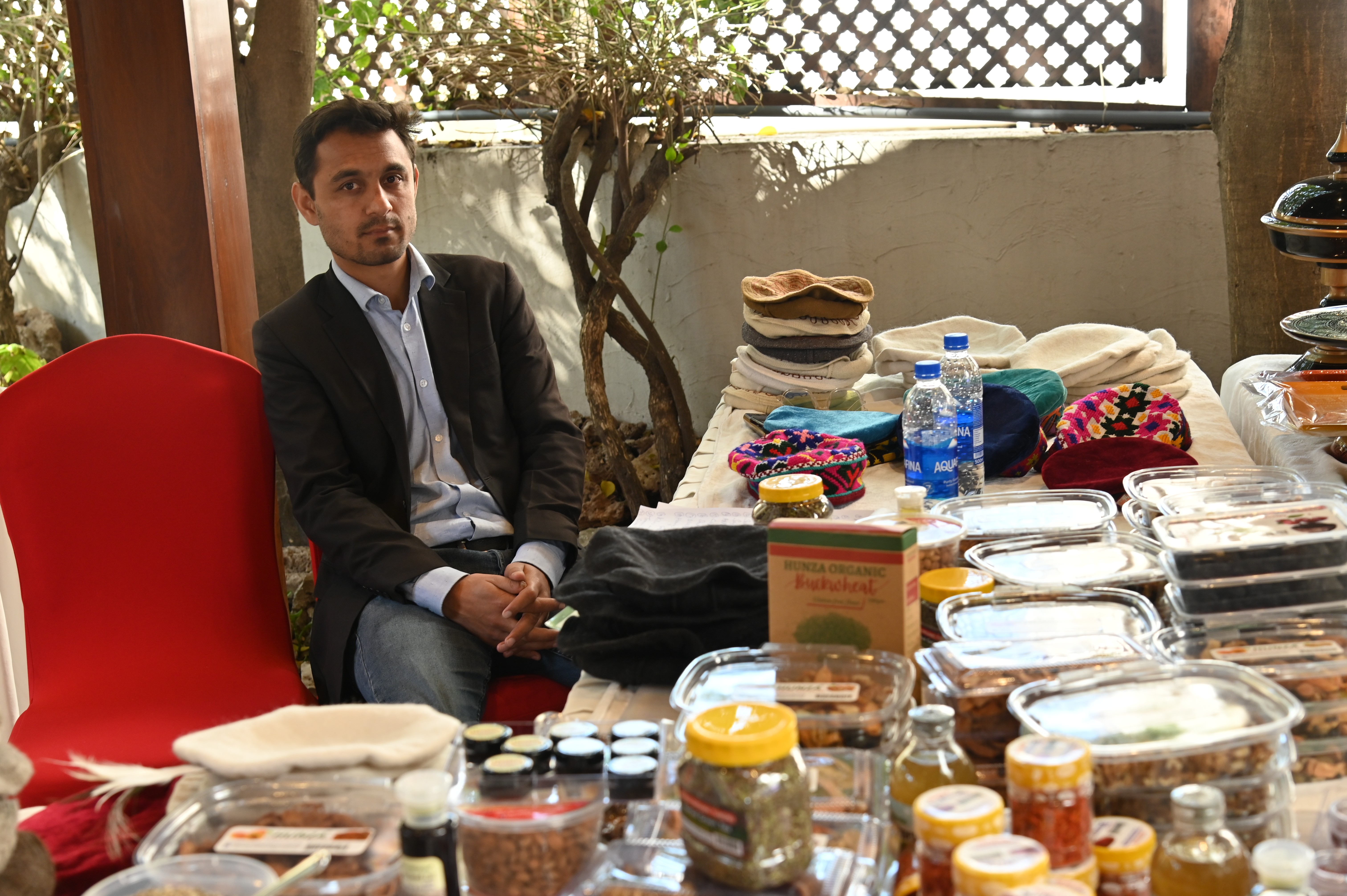 A man at dry fruit stall representing the specialities of Hunza