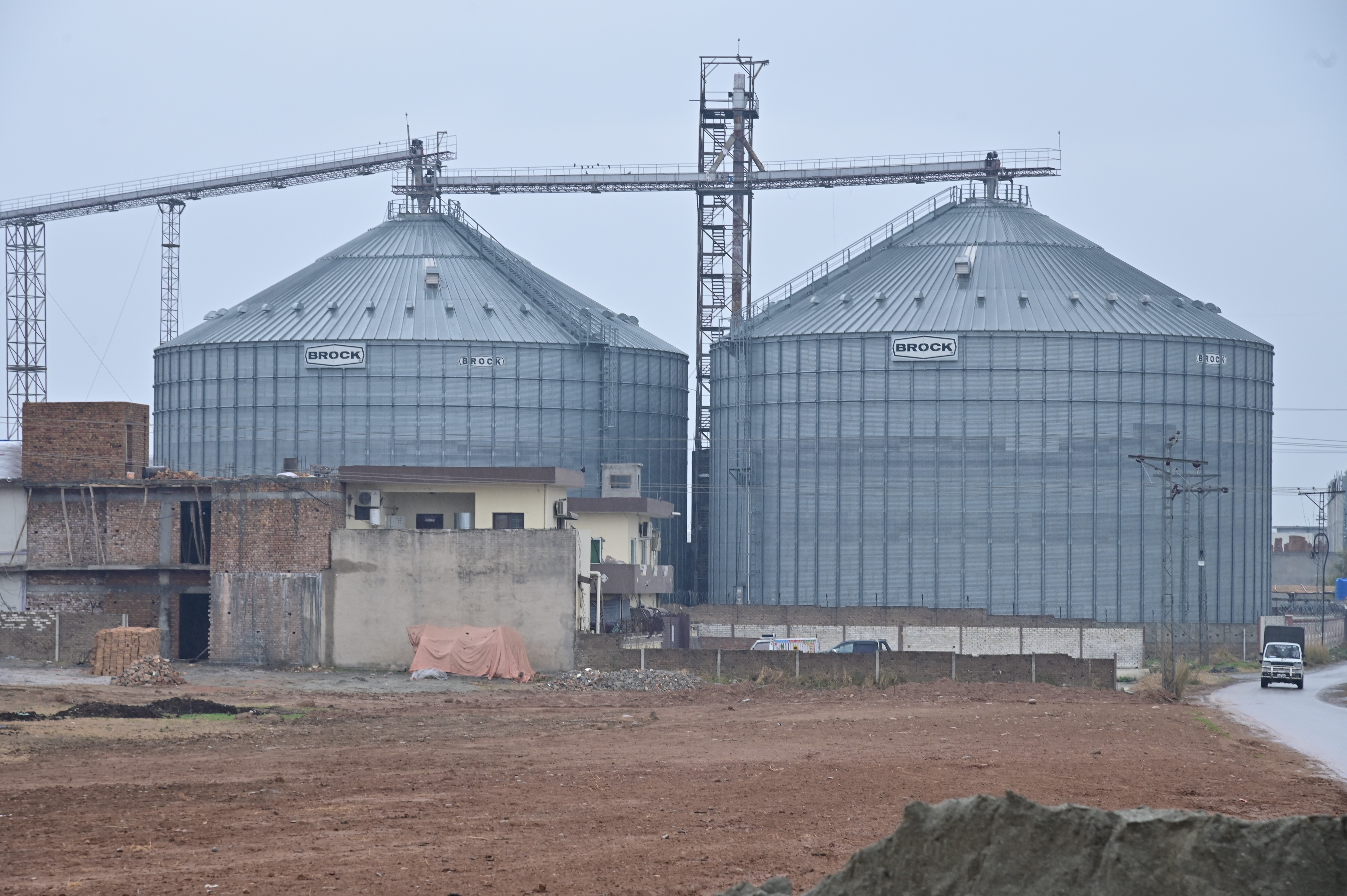 Industrial grain storage silos at a processing facility
