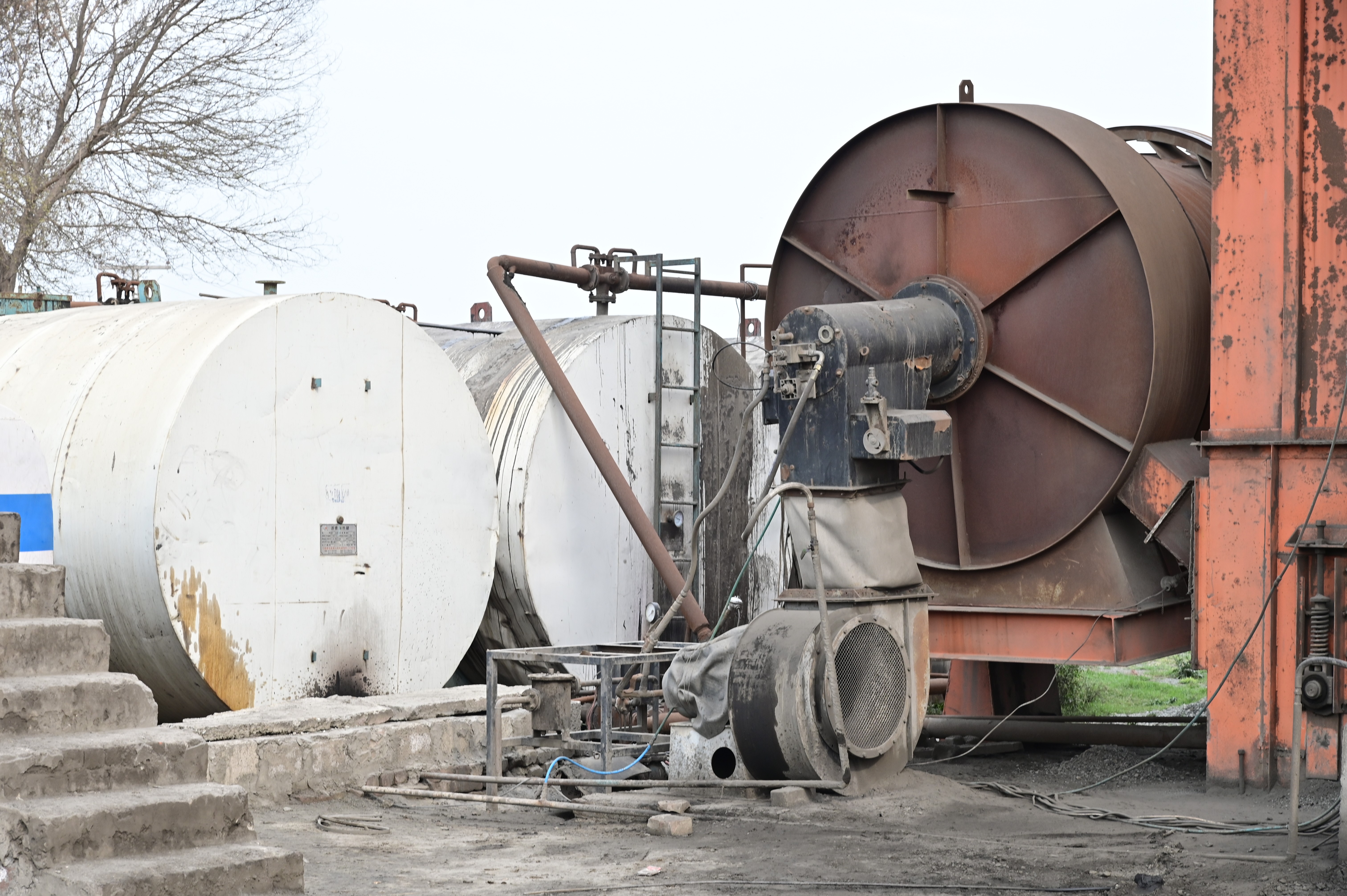 Industrial fuel storage tanks and a rotary drum