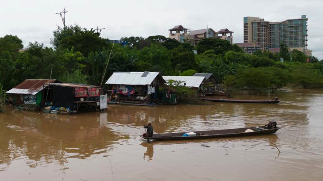 Aerial photo taken on August 20, 2022 shows villagers fish in Mekong River along their floating houses by the submerged sandbank, to the west of Lao capital Vientiane. (Photo by Kaikeo Saiyasane/Xinhua)